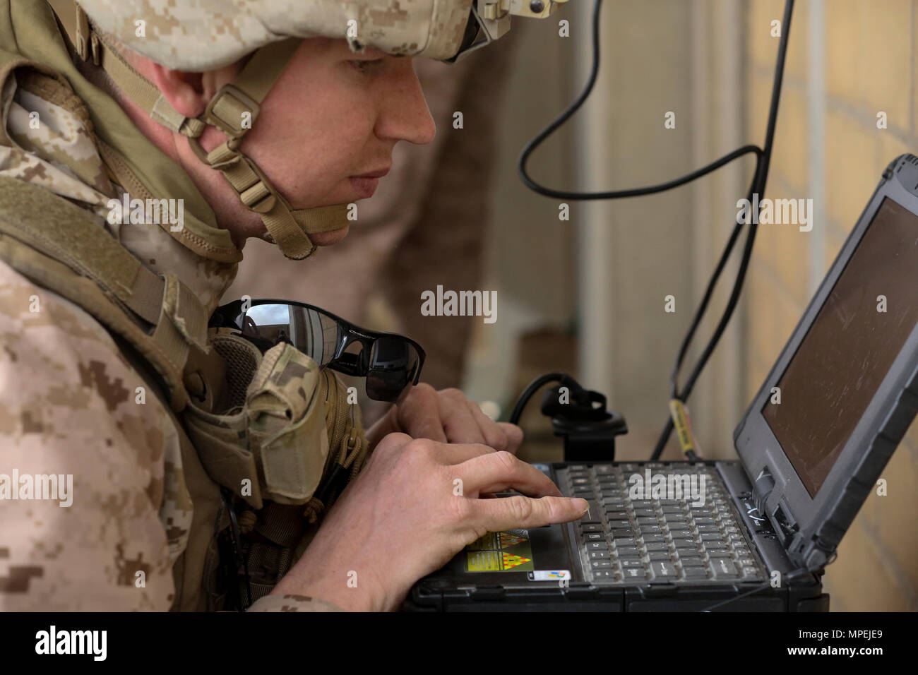 U.S. Marine Corps Sgt. Adam Tabor, radio chief with 4th Air Naval Gunfire Liaison Company, Special Purpose Marine Air-Ground Task Force-Crisis Response-Central Command, establishes a video downlink between joint terminal attack controllers during a close air support exercise while forward deployed to the Middle East Feb. 9, 2017. Coalition interoperability was the primary mission of the event and was an opportunity for the joint terminal attack controllers to become more proficient with their skills. SPMAGTF-CR-CC Marines consistently train to enhance their ability to react to any obstacle the Stock Photo