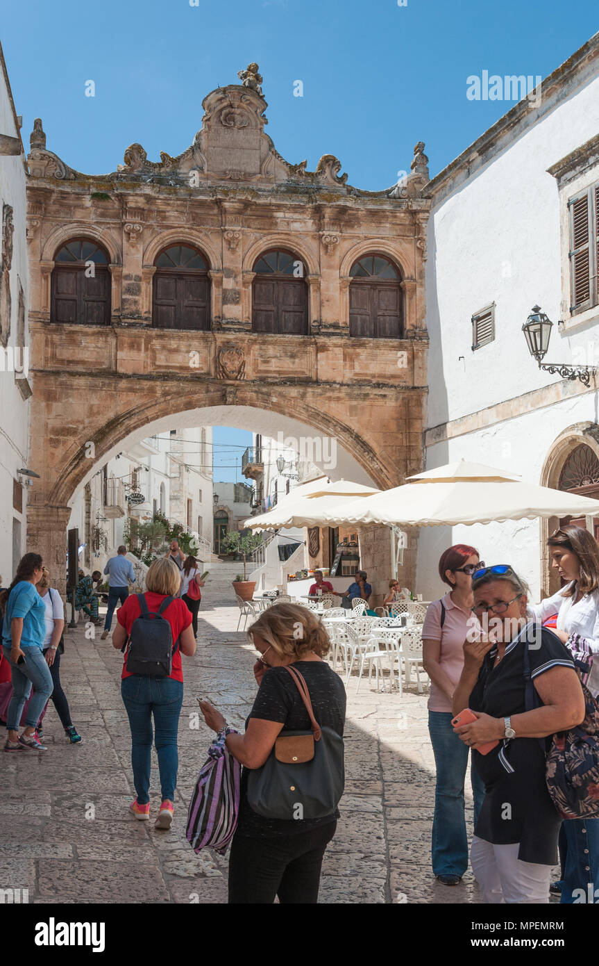 The arched loggia that links the PalazzoVescoville and Palazzo del Seminario, Ostuni, Puglia, Italy. Stock Photo