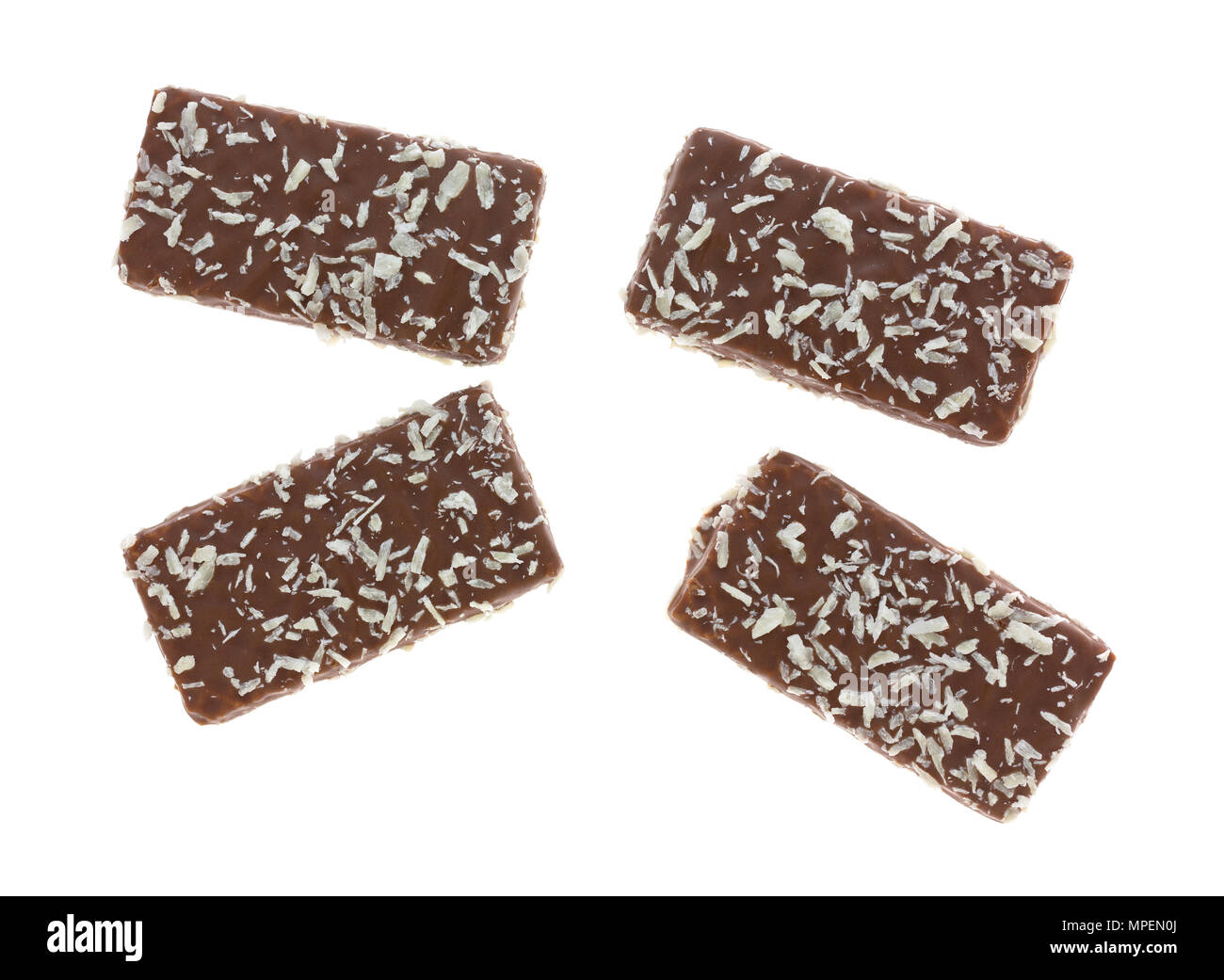 Top view of four chocolate wafer cookies with coconut flakes isolated on a white background