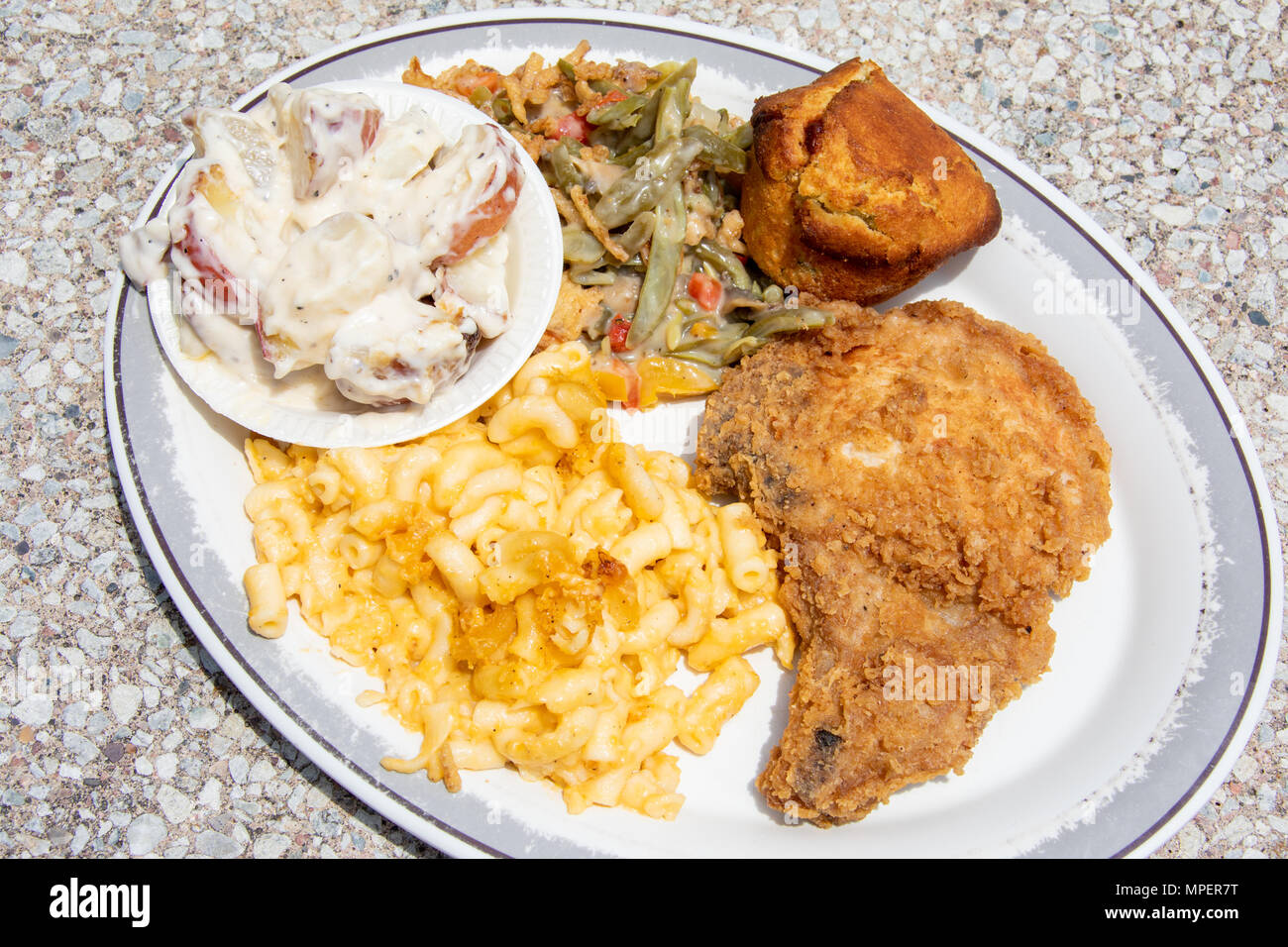 Breaded pork chop and sides at Derk's Filet and Vine Restaurant, Montgomery, Alabama Stock Photo