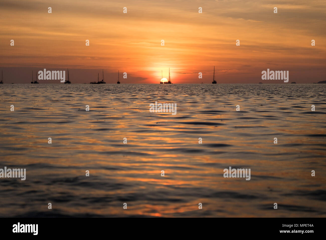Beautiful sunset above the sea beach Stock Photo - Alamy