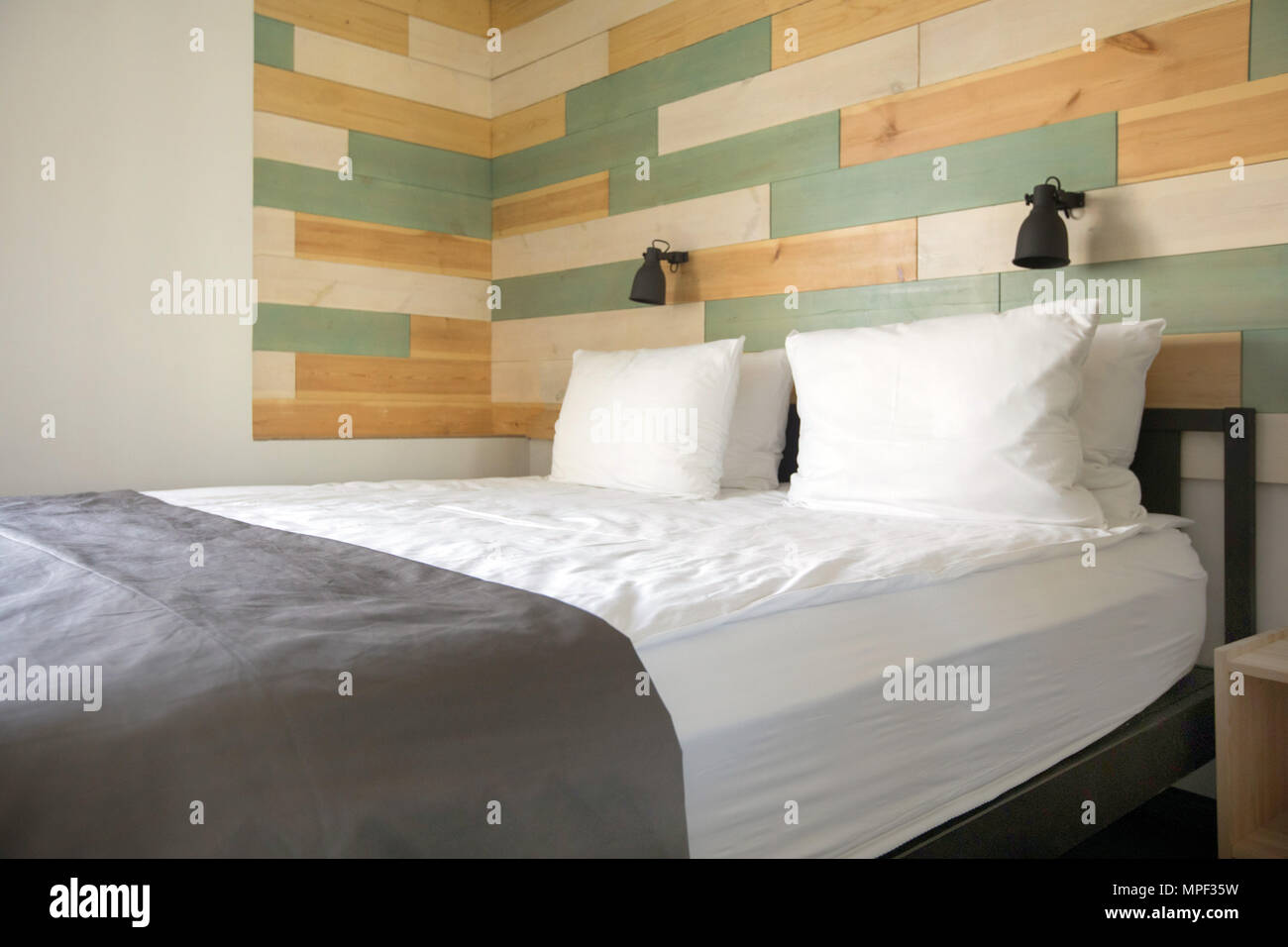 Comfortable bed in stylish bedroom Stock Photo Alamy