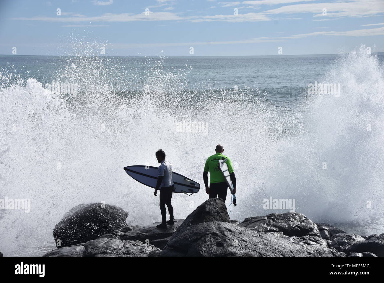 Surfers at Raglan, New Zealand Stock Photo