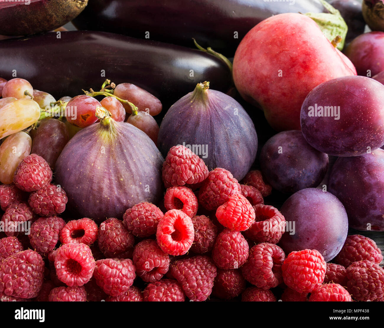 Purple food. Background of berries, fruits and vegetables. Fresh figs ...