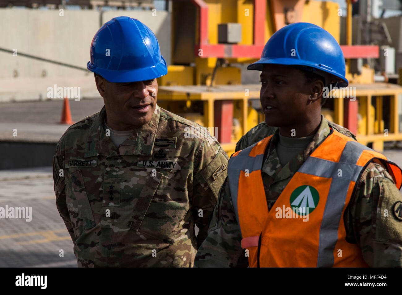 Lt. Gen. Michael X. Garrett, the U.S. Army Central Commander, is briefed by an 840th Transportation Battalion Soldier during his tour of the Port of Shuaiba, Kuwait Feb. 17. The 840th Transportation Battalion is responsible for incoming and outgoing shipments of equipment utilized by the units stationed in the USARCENT area of operations. Stock Photo