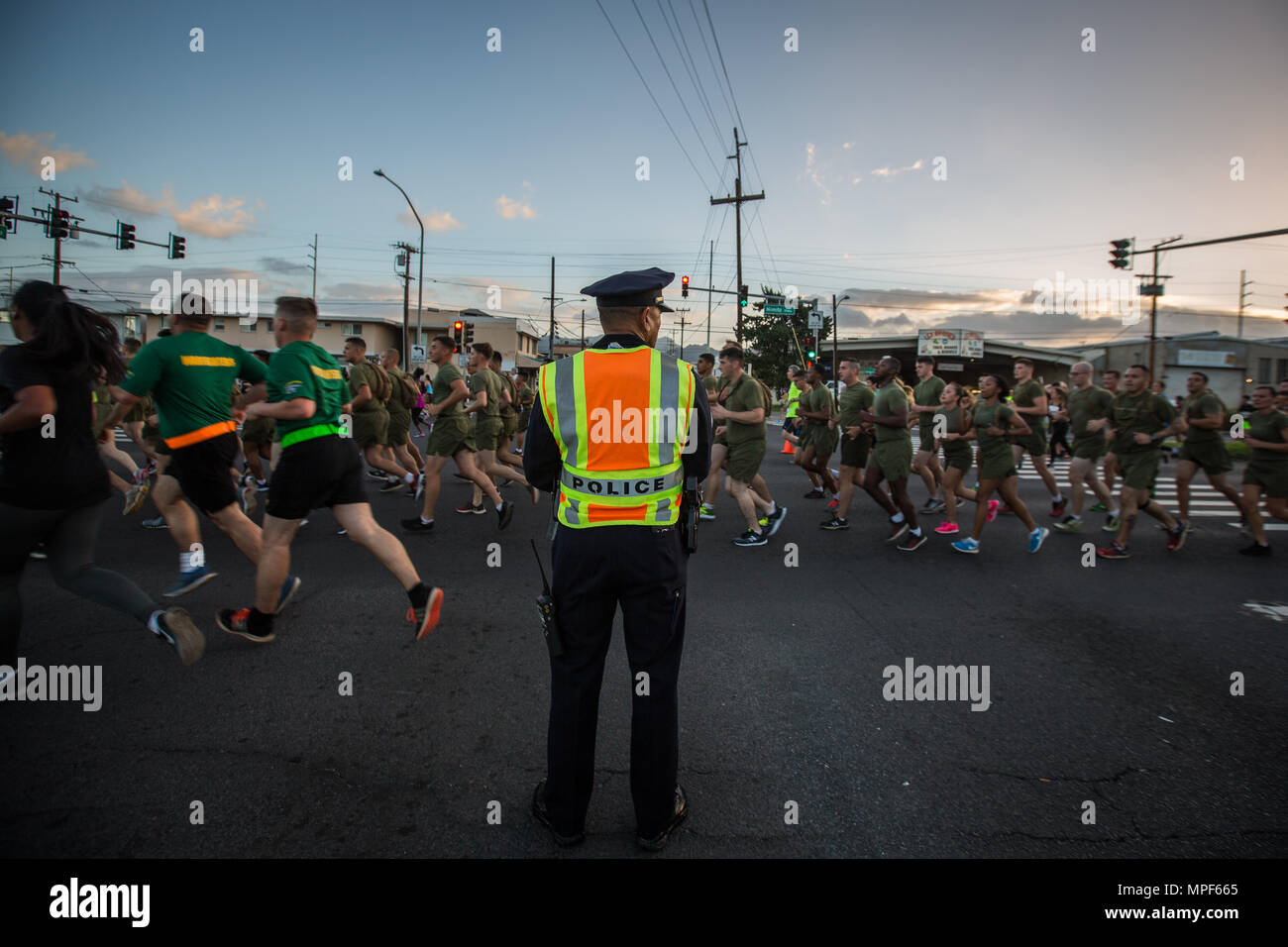 U.S. Marines with Combat Logistics Battalion 3, and U.S. Marine Corps Forces, Pacific, Headquarters and Service Battalion participate in  the 33rd Annual Great Aloha Run in Honolulu, Hawaii, Feb. 20, 2017. Over 20,000 runners took part in the 8.15-mile run from the Aloha tower to the Aloha Stadium. (U.S. Marine Corps photo by Lance Cpl. Miguel A. Rosales) Stock Photo