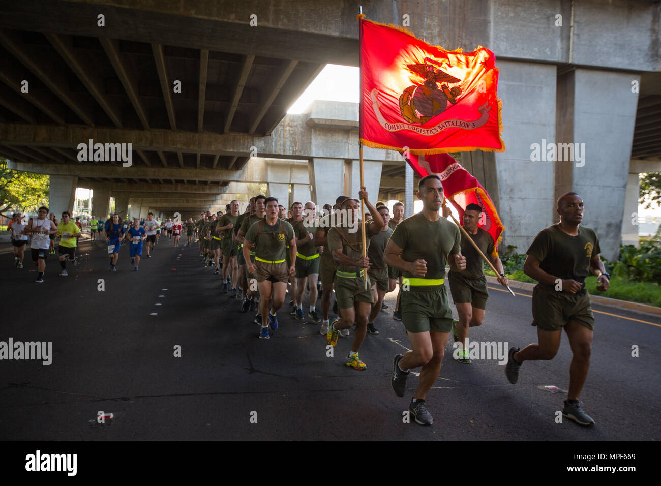 U.S. Marines with Combat Logistics Battalion 3, and U.S. Marine Corps Forces, Pacific, Headquarters and Service Battalion participate in the 33rd Annual Great Aloha Run in Honolulu, Hawaii, Feb. 20, 2017. Over 20,000 runners took part in the 8.15-mile run from the Aloha tower to the Aloha Stadium. (U.S. Marine Corps photo by Lance Cpl. Miguel A. Rosales) Stock Photo