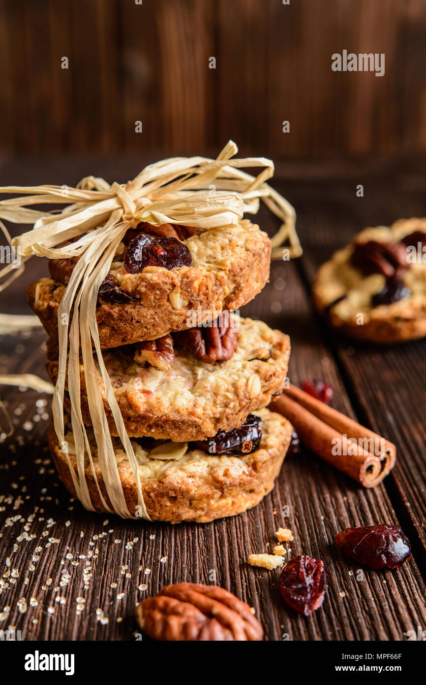Homemade whole wheat oatmeal cookies with pecan nuts, dried cranberries