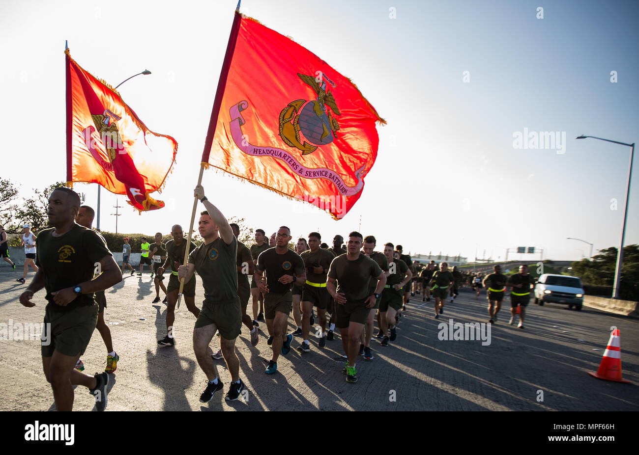 U.S. Marines with Combat Logistics Battalion 3, and U.S. Marine Corps Forces, Pacific, Headquarters and Service Battalion participate in the 33rd Annual Great Aloha Run in Honolulu, Hawaii, Feb. 20, 2017. Over 20,000 runners took part in the 8.15-mile run from the Aloha tower to the Aloha Stadium. (U.S. Marine Corps photo by Lance Cpl. Miguel A. Rosales) Stock Photo