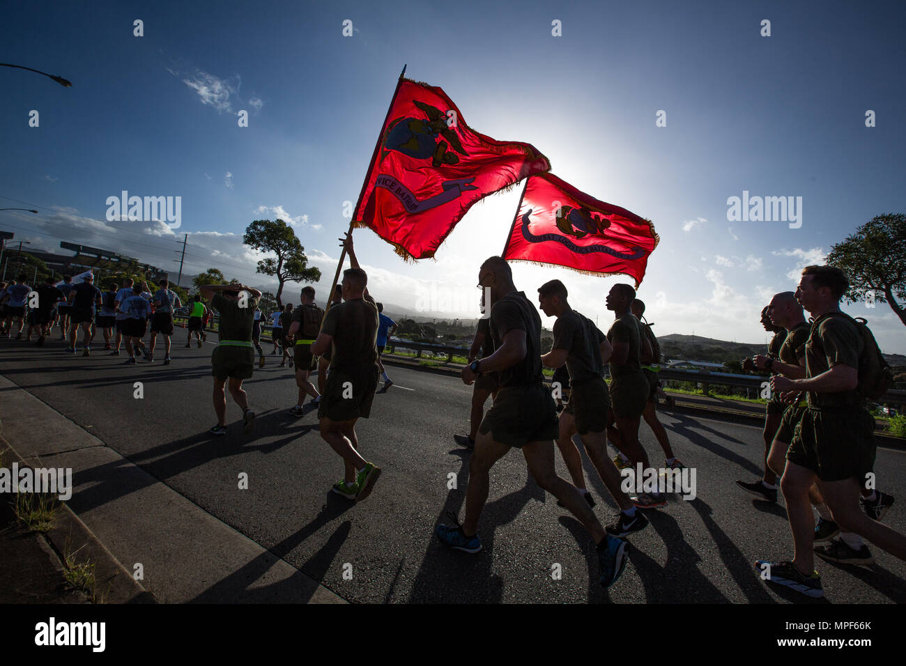 U.S. Marines with Combat Logistics Battalion 3, and U.S. Marine Corps Forces, Pacific, Headquarters and Service Battalion participate in the 33rd Annual Great Aloha Run in Honolulu, Hawaii, Feb. 20, 2017. Over 20,000 runners took part in the 8.15-mile run from the Aloha tower to the Aloha Stadium. (U.S. Marine Corps photo by Lance Cpl. Miguel A. Rosales) Stock Photo