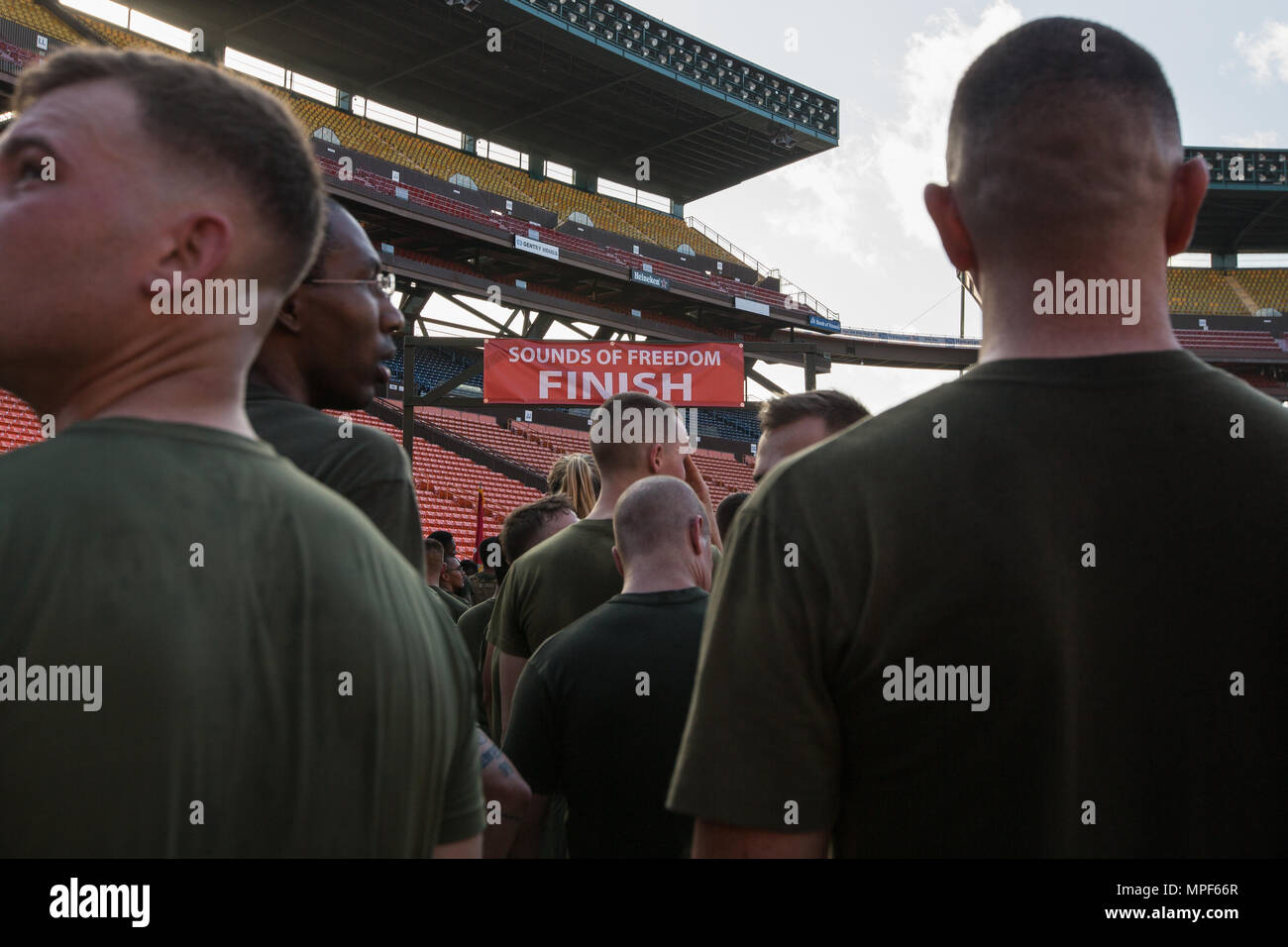 U.S. Marines with Combat Logistics Battalion 3, and U.S. Marine Corps Forces, Pacific, Headquarters and Service Battalion participate in the 33rd Annual Great Aloha Run in Honolulu, Hawaii, Feb. 20, 2017. Over 20,000 runners took part in the 8.15-mile run from the Aloha tower to the Aloha Stadium. (U.S. Marine Corps photo by Lance Cpl. Miguel A. Rosales) Stock Photo