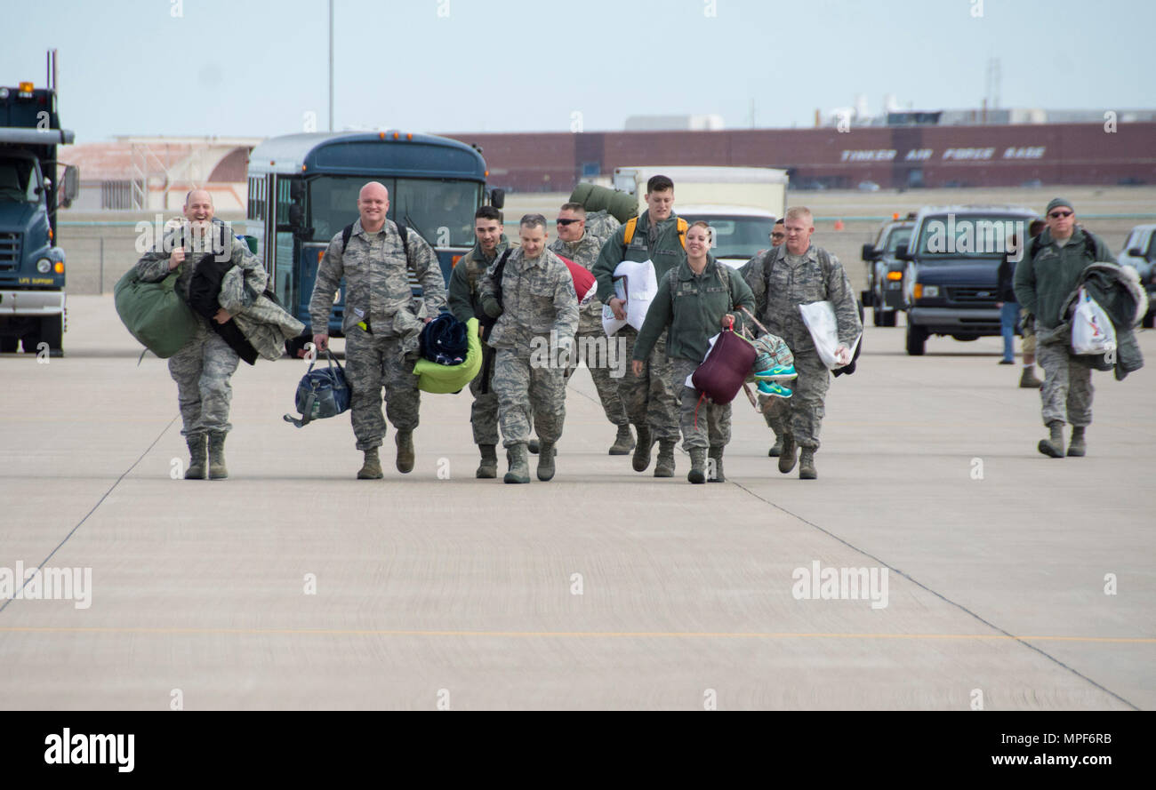 Reserve Citizen Airmen from the 507th Air Refueling Wing at Tinker Air Force Base, Okla., walk across the flightline to greet their loved ones upon returning return home following a deployment Feb. 17, 2017. More than 90 Reserve Citizen Airmen from the 507th ARW deployed in December 2016 in support of air operations at Incirlik Air Base, Turkey. The deployed crews flew 580 missions across 3,027 flight hours, delivering 35.3 million pounds of fuel to 3,413 receiver aircraft, all while being separated from loved ones over the holidays. (U.S. Air Force photo/Tech. Sgt. Lauren Gleason) Stock Photo