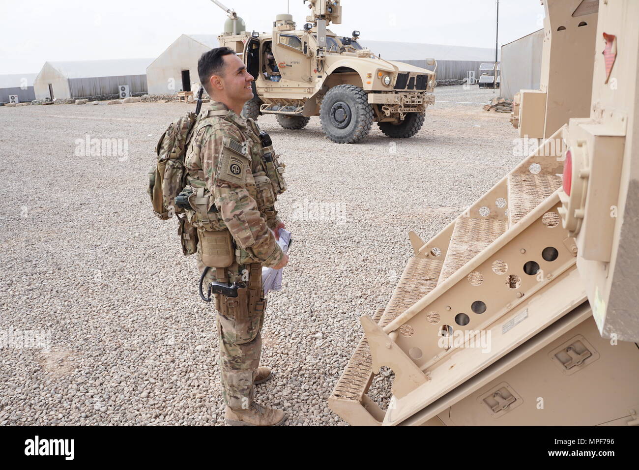 U.S. Army Capt. Omar Cavalier inspects vehicles and crew participating ...