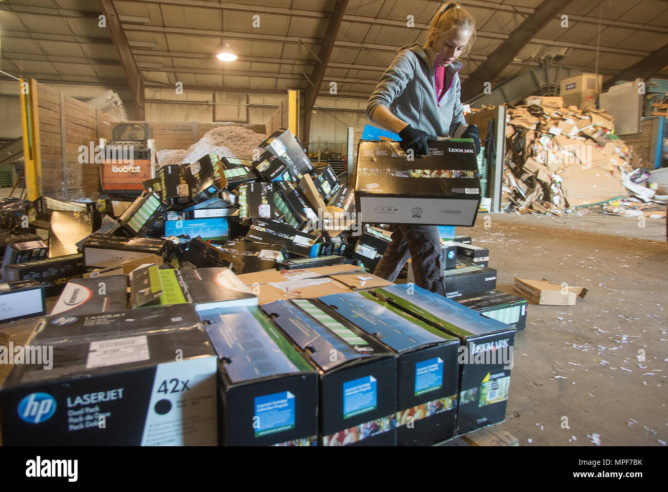 Hannah Wegner, 88th Civil Engineering Group recycling center laborer,  palletizes toner cartridges, Feb. 13, 2017, in the Wright-Patterson Air  Force Base, Ohio, recycling center. The recycling center has restarted  collecting toner cartridges