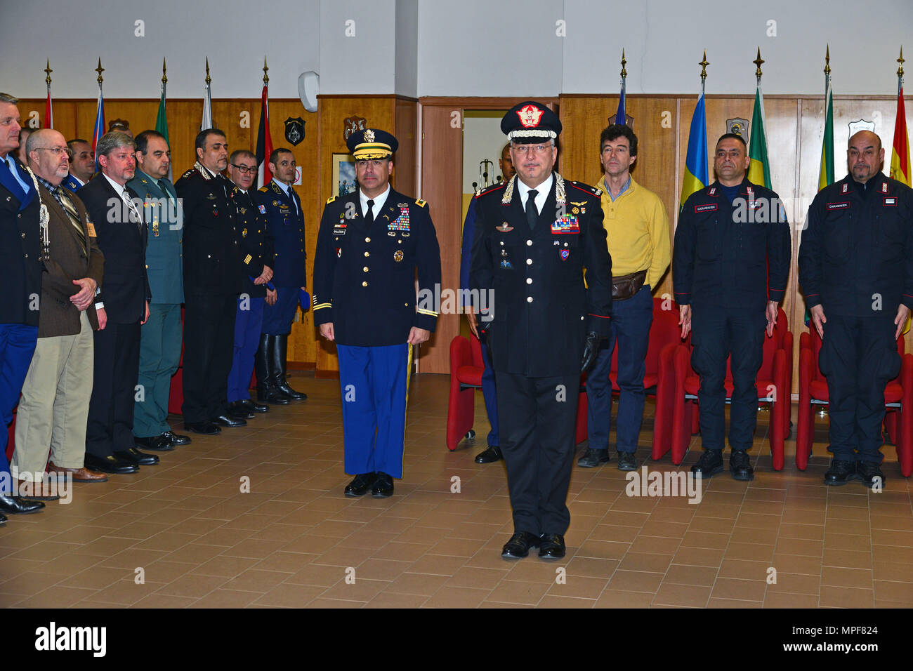 Brig. Gen. Giovanni Pietro Barbano (right), Center of Excellence for Stability Police Units (CoESPU) director and U.S. Army Col. Darius S. Gallegos (left), CoESPU deputy director, stand at attention during the graduation ceremony of 14th Protection of Civilians Course at the CoESPU in Vicenza, Italy, February 21, 2017. (U.S. Army Photo by Visual Information Specialist Paolo Bovo/released) Stock Photo