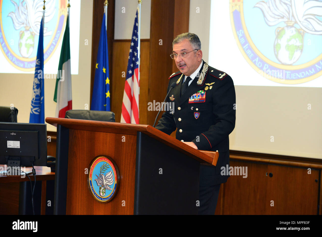 Commanding General, Brig. Gen. Giovanni Pietro Barbano (right), Center of Excellence for Stability Police Units (CoESPU) director, addresses dignitaries and guests from Europe, Africa, Italy and the U.S. during the graduation ceremony of the 14th Protection of Civilians Course at the CoESPU in Vicenza, Italy, February 21, 2017. (U.S. Army Photo by Visual Information Specialist Paolo Bovo/released) Stock Photo