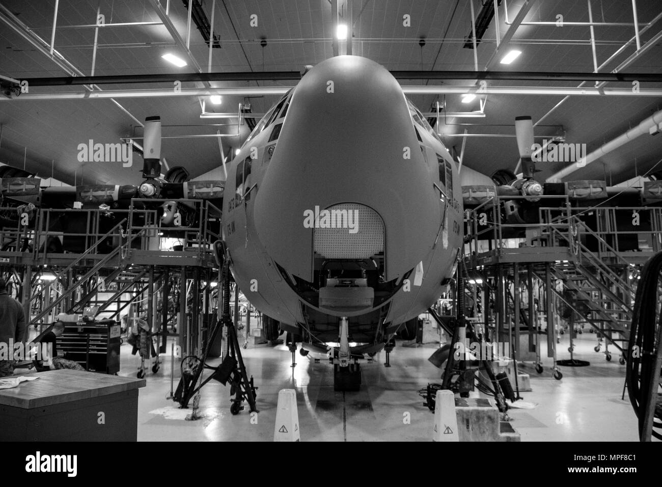 179th Airlift Wing Maintenance members conduct an isochronal inspection of a C-130H Hercules Feb. 14, 2017, at the 179th Airlift Wing, Mansfield, Ohio.  The 179th Airlift Wing is always on mission to be the first choice to respond to community, state and federal missions with a trusted team of highly qualified Airmen. (U.S. Air National Guard photo by 1st Lt. Paul Stennett/Released) Stock Photo