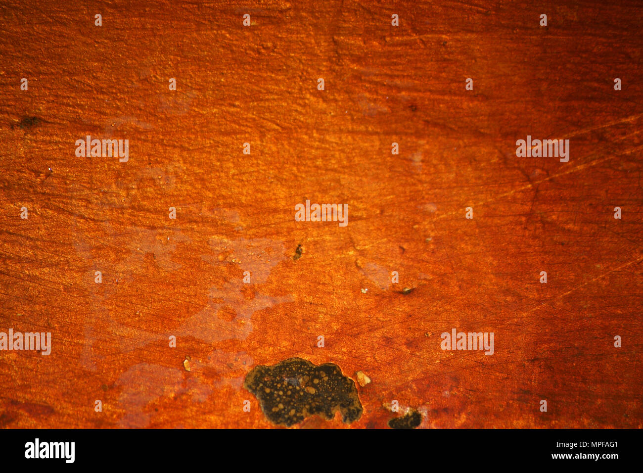 The close-up of the surface of a water basin made of emaile with mineral and iron-containing deposits and discoloration. Stock Photo