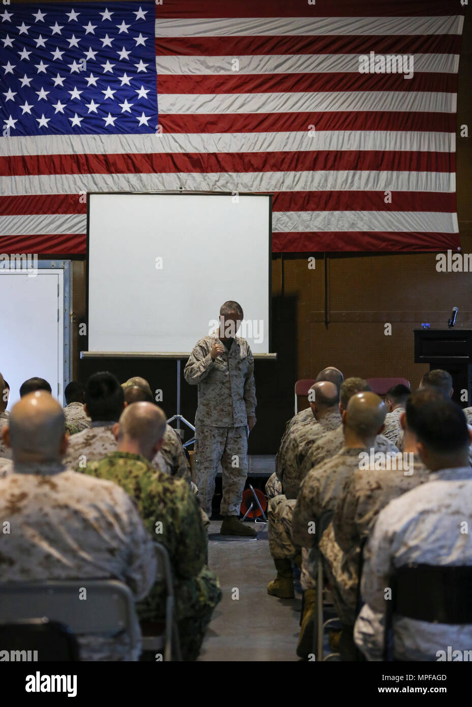 U.S. Marine Sgt. Maj. William T. Thurber, Marine Corps Forces Central Command (MARCENT) Sergeant Major, speaks to the Marines and Sailors of Naval Amphibious Force, Task Force 51/5th Marine Expeditionary Brigade during a command visit at Naval Support Activity Bahrain, Feb. 23, 2017. Lt. Gen. William D. Beydler, MARCENT commanding general and Sgt. Maj. Thurber visited the Marines and Sailors of 51/5 to address evolving topics in the future of the Marine Corps and naval integration. (U.S. Marine Corps photo by Cpl. Lucio Jessica Y. /RELEASED) Stock Photo