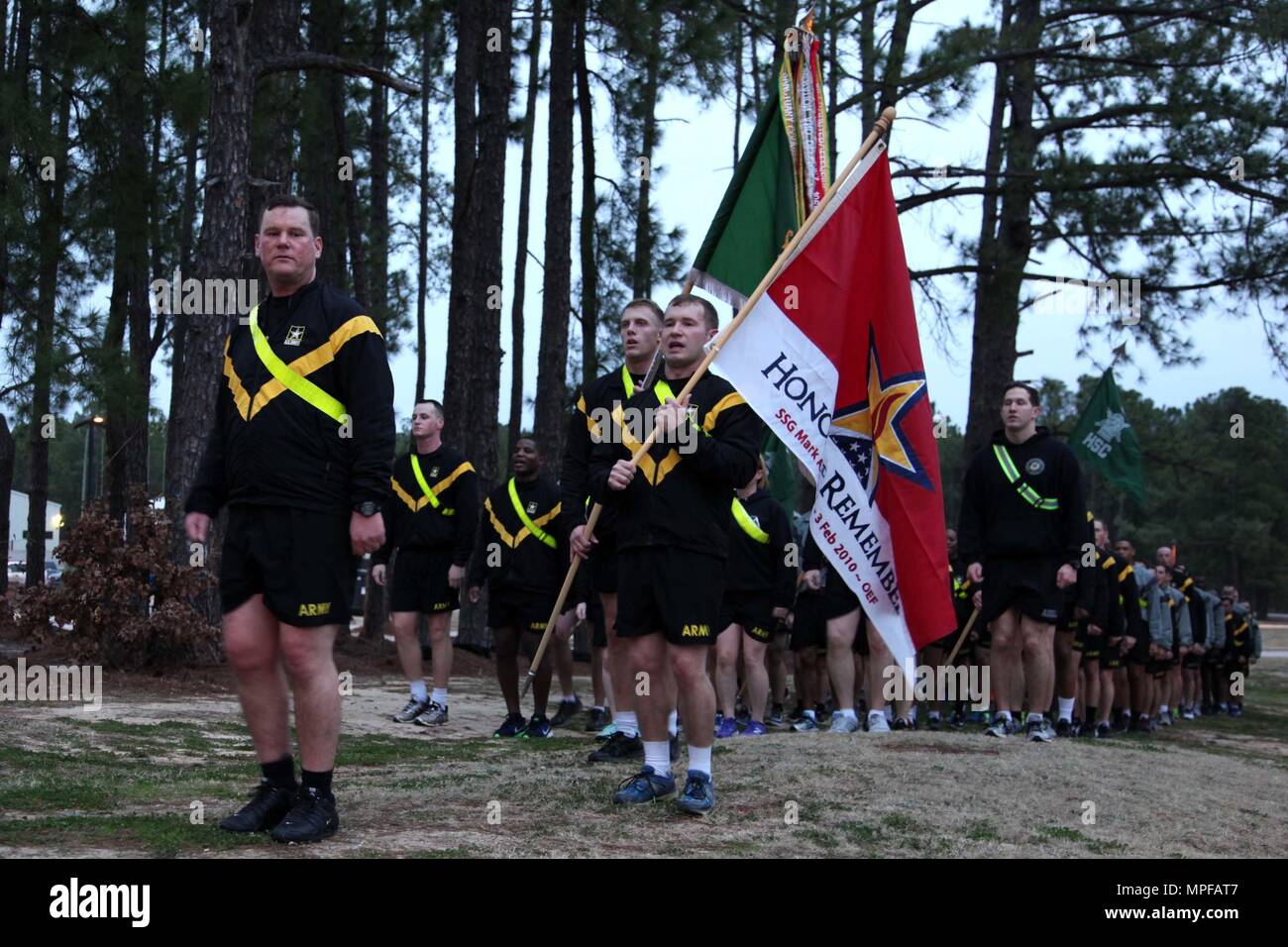 Lt. Col. Marcus Welch, commander of 8th Military Information Support Battalion, 4th Military Information Support Group, returns from a four-mile run with his Paratroopers on Feb. 3, 2017, honoring Staff Sgt. Mark Stets, Jr., who was killed in action Feb. 3, 2010. Unit leaders and Stets’ parents took time before and after the run to speak of their memories of the fallen Soldier. The formation ran with Stets’ “Honor and Remember” flag in front of the battalion colors. Stock Photo