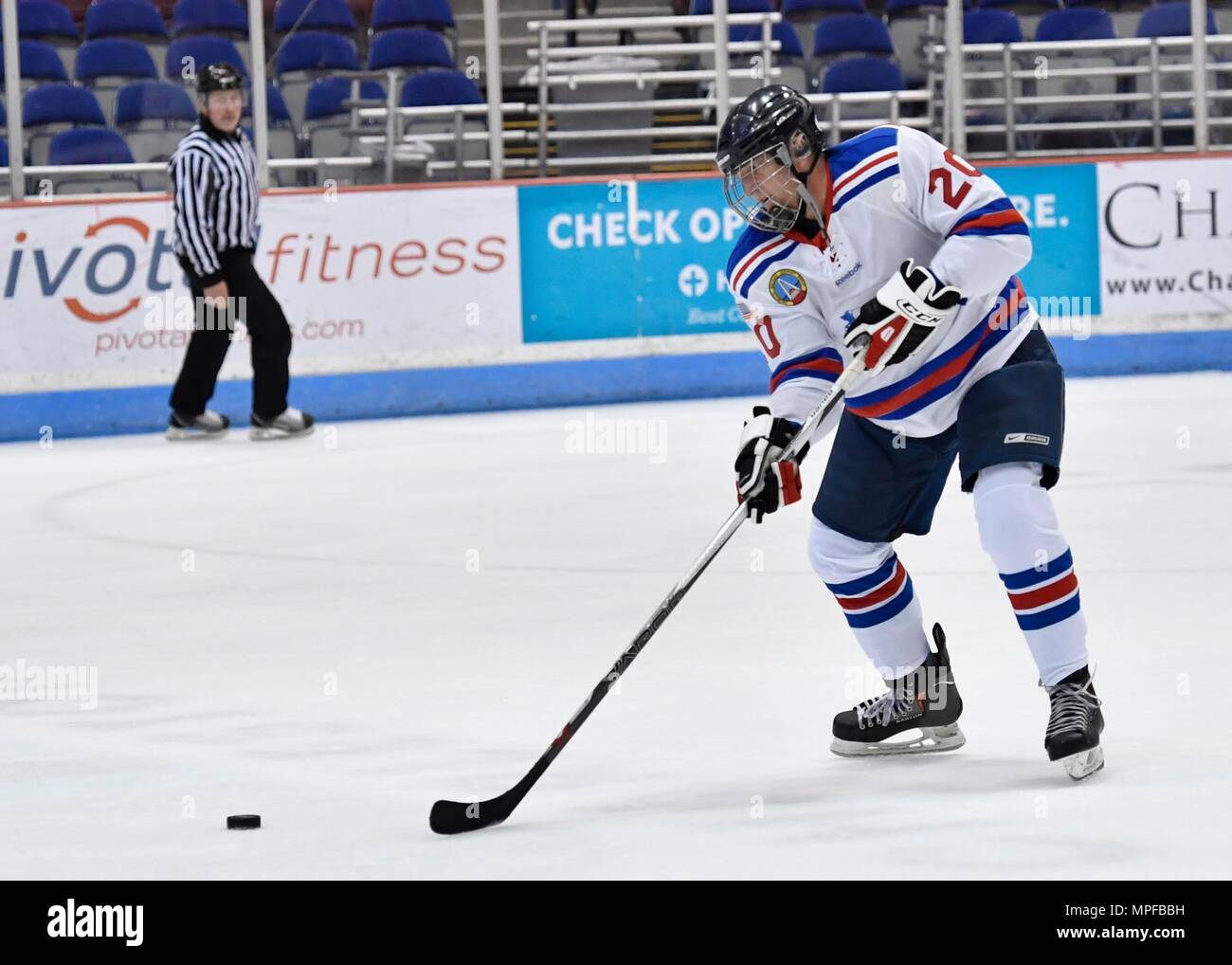 Members of the Charleston Patriots and the Charleston Enforcers play hockey during the 3rd Annual Matuskovic Charity Hockey Game at the North Charleston Coliseum & Performing Arts Center, Feb. 18, 2017. The game is played in memory of Joe Matuskovic, Charleston County Sherriff’s deputy, and other service members and first responders killed in the line of duty. Members of the Charleston Patriots are from Joint Base Charleston while members of the Charleston Enforcers are from the Charleston County Sheriff’s office and fire department.The Charleston Enforcers won the game with a final score of 1 Stock Photo