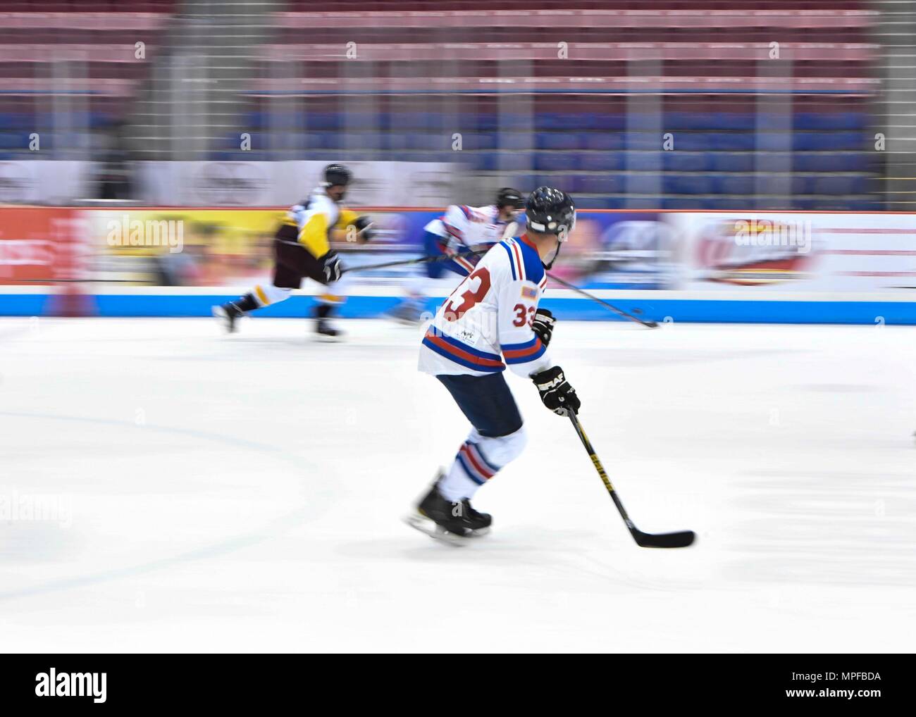 Members of the Charleston Patriots and the Charleston Enforcers play hockey during the 3rd Annual Matuskovic Charity Hockey Game at the North Charleston Coliseum & Performing Arts Center, Feb. 18, 2017. The game is played in memory of Joe Matuskovic, Charleston County Sherriff’s deputy, and other service members and first responders killed in the line of duty. Members of the Charleston Patriots are from Joint Base Charleston while members of the Charleston Enforcers are from the Charleston County Sheriff’s office and fire department.The Charleston Enforcers won the game with a final score of 1 Stock Photo