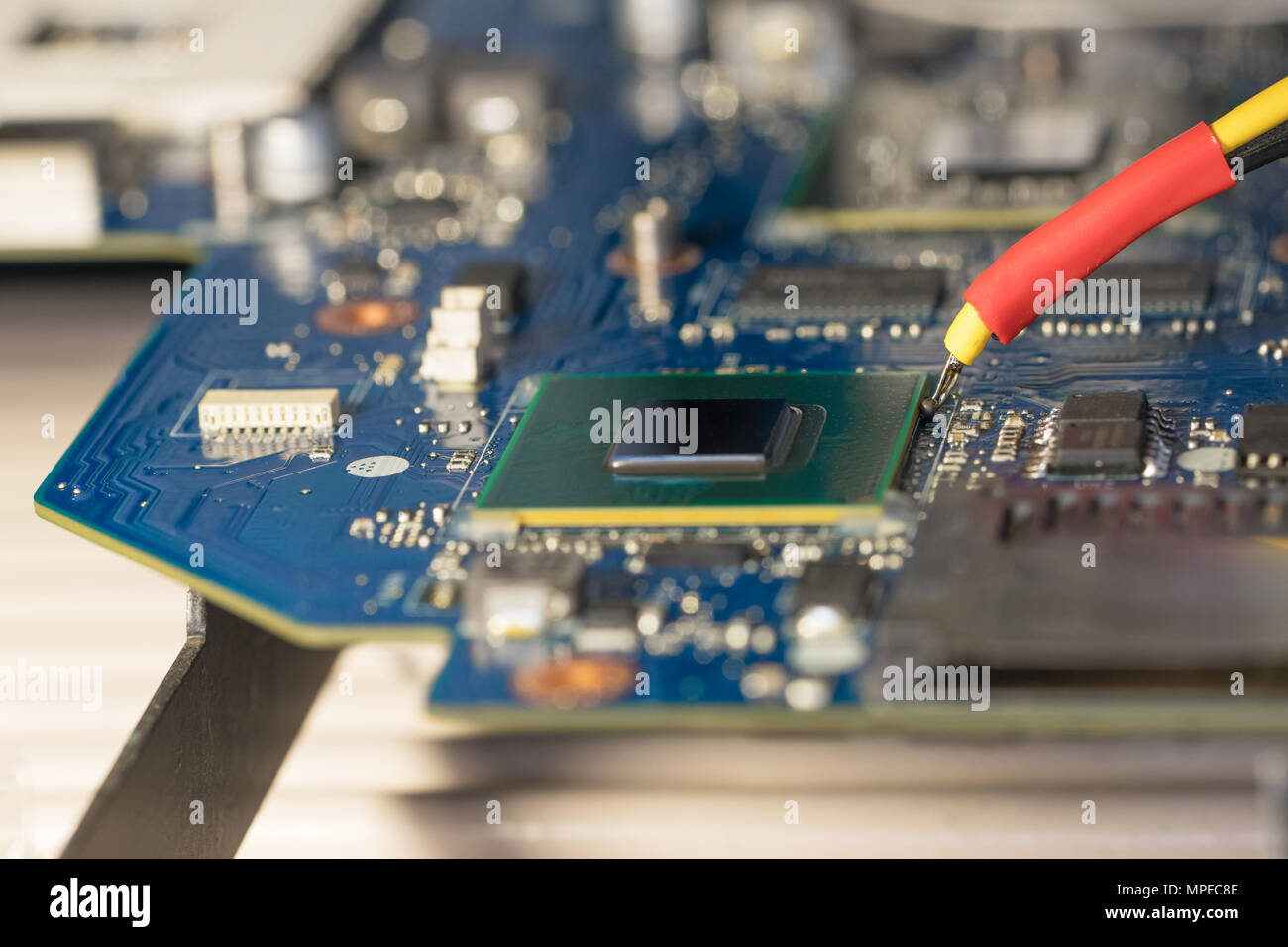 Laptop repair. Replacement chip graphics card on the infrared soldering