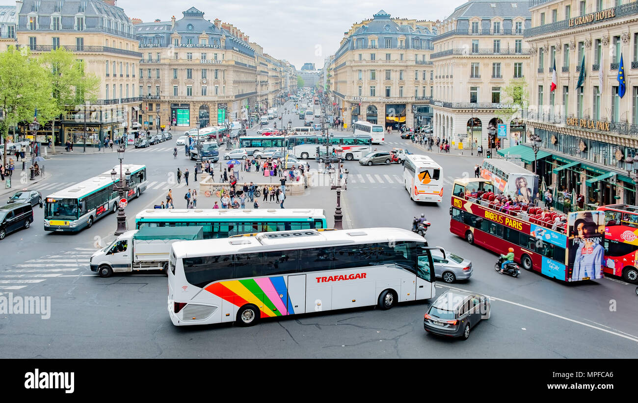 Busy Paris traffic photographed near to the Paris Opera House. Stock Photo