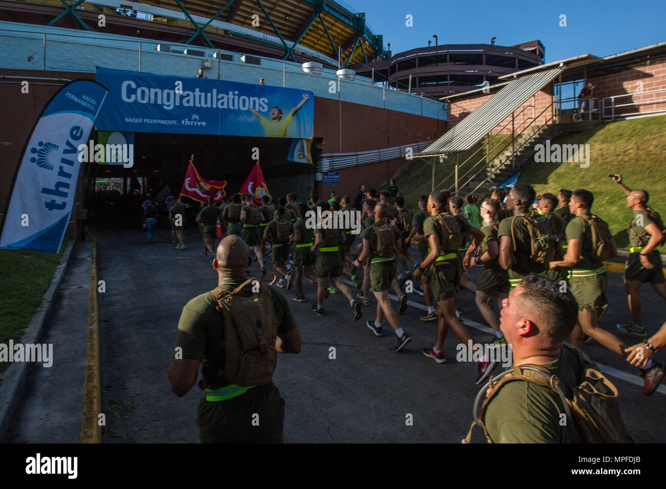 U.S. Marines with Combat Logistics Battalion 3, and U.S. Marine Corps Forces, Pacific, Headquarters and Service Battalion participate in the 33rd Annual Great Aloha Run in Honolulu, Hawaii, Feb. 20, 2017. Over 20,000 runners took part in the 8.15-mile run from the Aloha tower to the Aloha Stadium. (U.S. Marine Corps photo by Lance Cpl. Miguel A. Rosales) Stock Photo