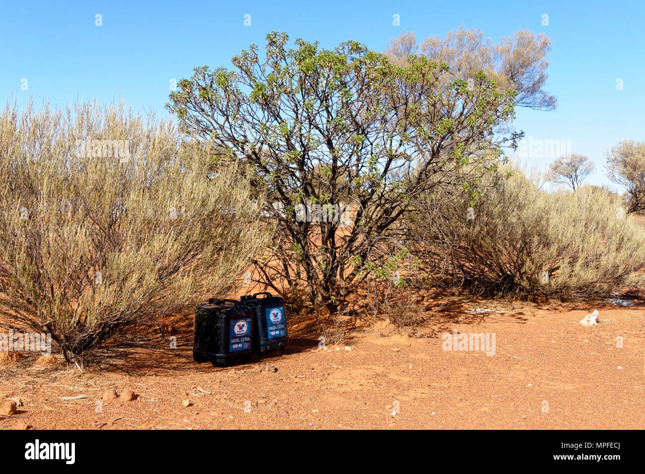 Plastic motor oil containers left in Australian outback, Goldfields, Western Australia Stock Photo