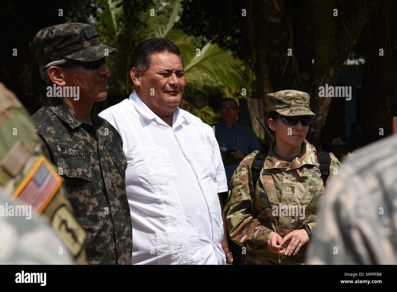 Col. Tito Livio Moreno, Commander of the Honduran 105th Infantry Brigade (left), Mr. Ricardo Alvarado Mayor of Omoa (center) and U.S. Army Maj. Rosemary Reed, Deputy Commander of Joint Task Force-Bravo Civil Military Operations, tour the facilities where a Medical Readiness Training Exercise is taking place in Corinto, Cortes, Feb. 16, 2017. The MEDRETE included participation from JTF-Bravo personnel, Honduran Ministry of Health providers, Red Cross volunteers and local military. (U.S. Army photo by Maria Pinel) Stock Photo