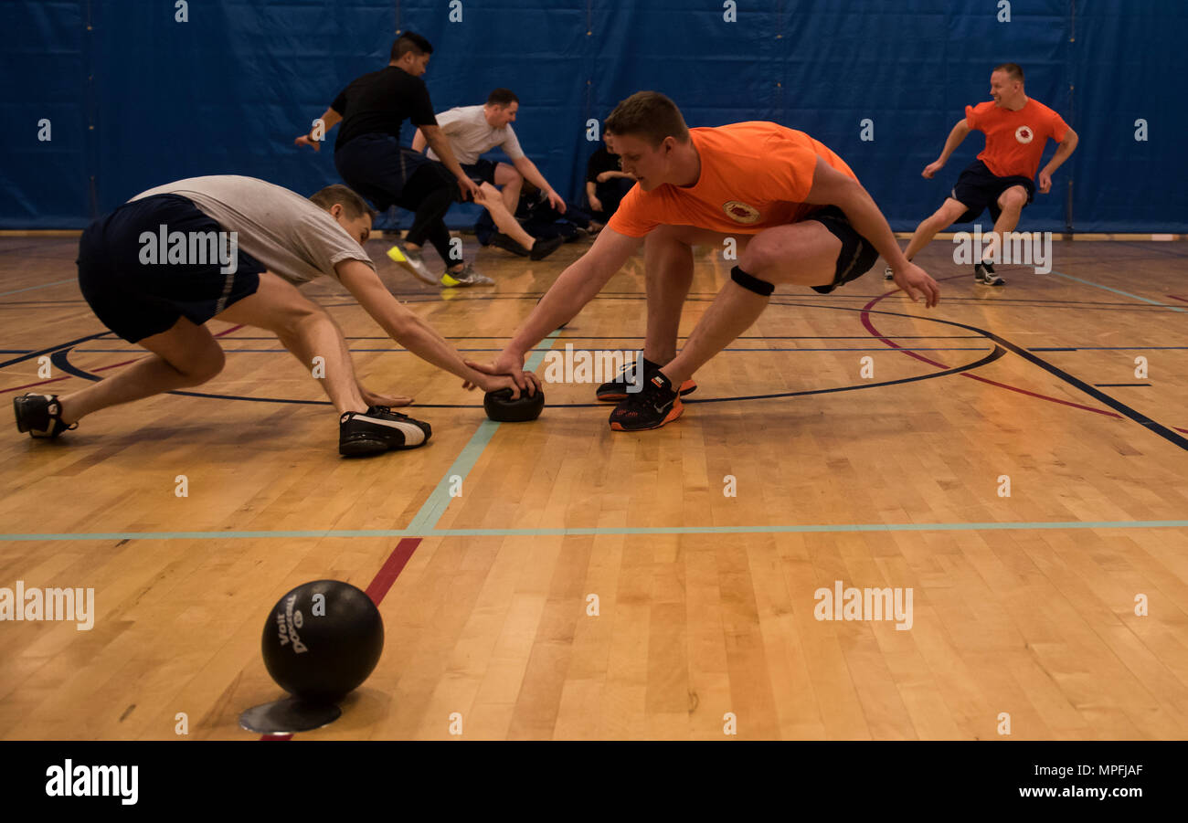 92nd Civil Engineer Squadron Airmen play dodge ball against 92nd Logistics Readiness Squadron during the 92nd Mission Support Group Fun Day Feb. 24, 2017, at Fairchild Air Force Base. The 92nd MSG Fun Day is a quarterly event organized by a NCO or CGO to help them further develop leadership skills and push them out of their comfort zone. Stock Photo