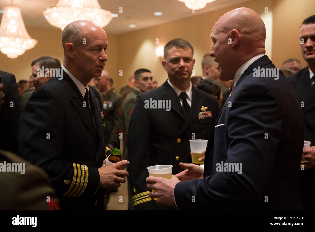 Sgt. Maj. Micheal Barrett (ret.), right, speaks to Marines and Sailors with 1st Marine Logistics Group during the 1st MLG Officer and Staff Noncommissioned Officer Mess Night at Camp Pendleton, Calif., March 3, 2017. Barrett, the 17th Sergeant Major of the Marine Corps, was the honored guest at the mess night, an event designed to foster camaraderie and esprit de corps. (U.S. Marine Corps photo by Sgt. Abbey Perria) Stock Photo