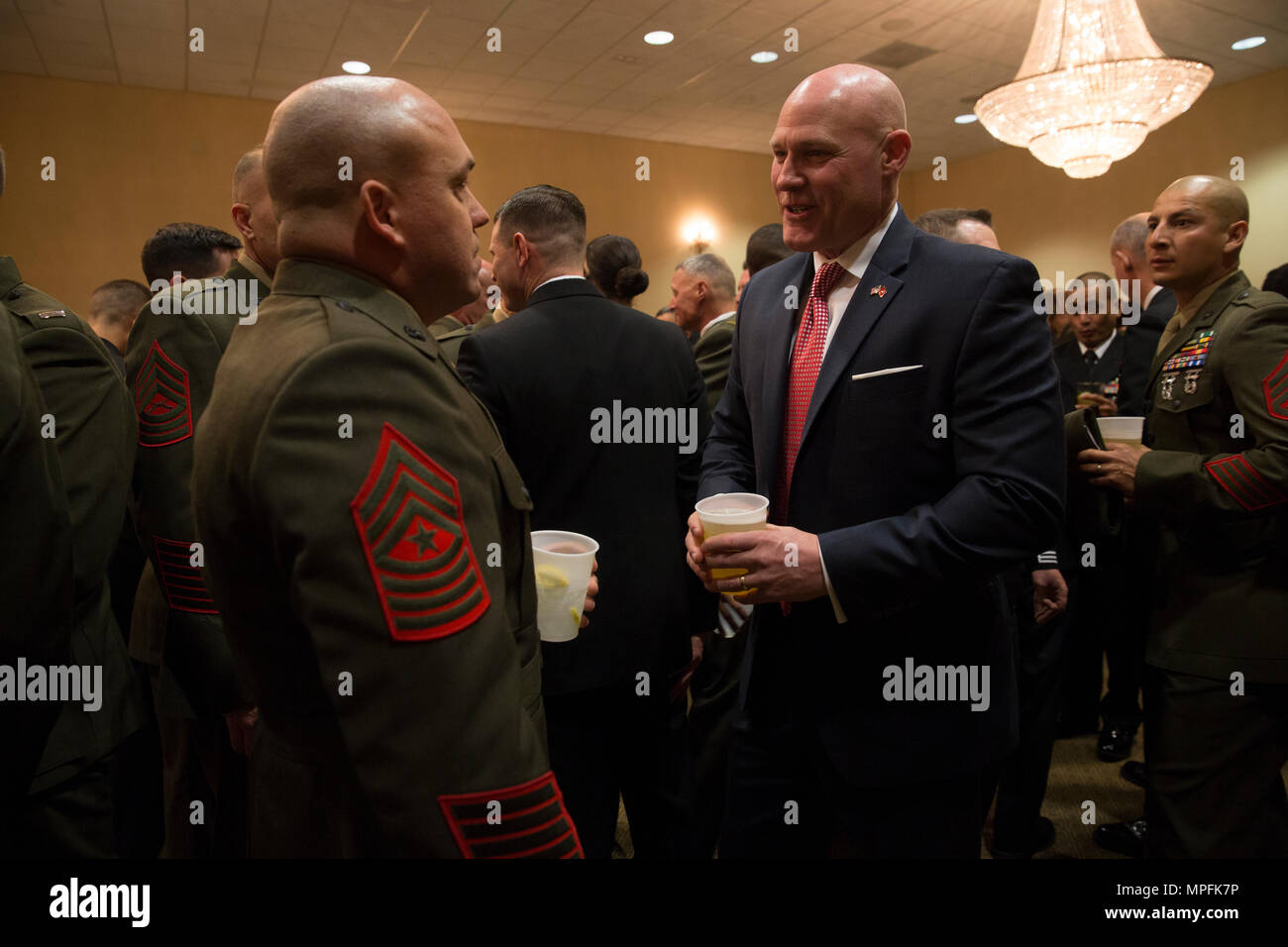 Sgt. Maj. Micheal Barrett (ret.), right, speaks to Marines and Sailors with 1st Marine Logistics Group during the 1st MLG Officer and Staff Noncommissioned Officer Mess Night at Camp Pendleton, Calif., March 3, 2017. Barrett, the 17th Sergeant Major of the Marine Corps, was the honored guest at the mess night, an event designed to foster camaraderie and esprit de corps. (U.S. Marine Corps photo by Sgt. Abbey Perria) Stock Photo