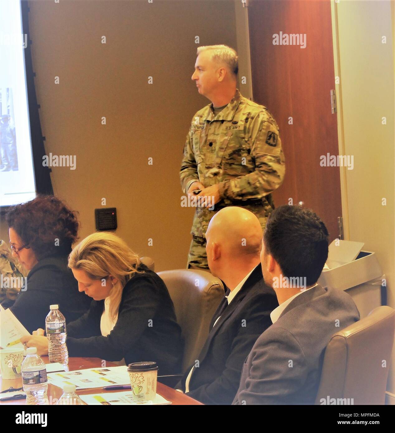 Lt. Col. Brendan Thompson, deputy commander of the Army Reserve Cyber Operations Group, South West Cyber Protection Center, 335th Signal Command (Theater), briefs a congressional staff delegation from the Army House Liaison Division, representing various congressional offices, and ARCOG command leaders Feb.11 in Adelphi, Maryland.  ARCOG leaders met with members of the staff delegation to address measures that are used to meet the challenges of making a cybersecurity unit fully operational. (U.S. Army Reserve Photo by Sgt. Erick Yates) Stock Photo