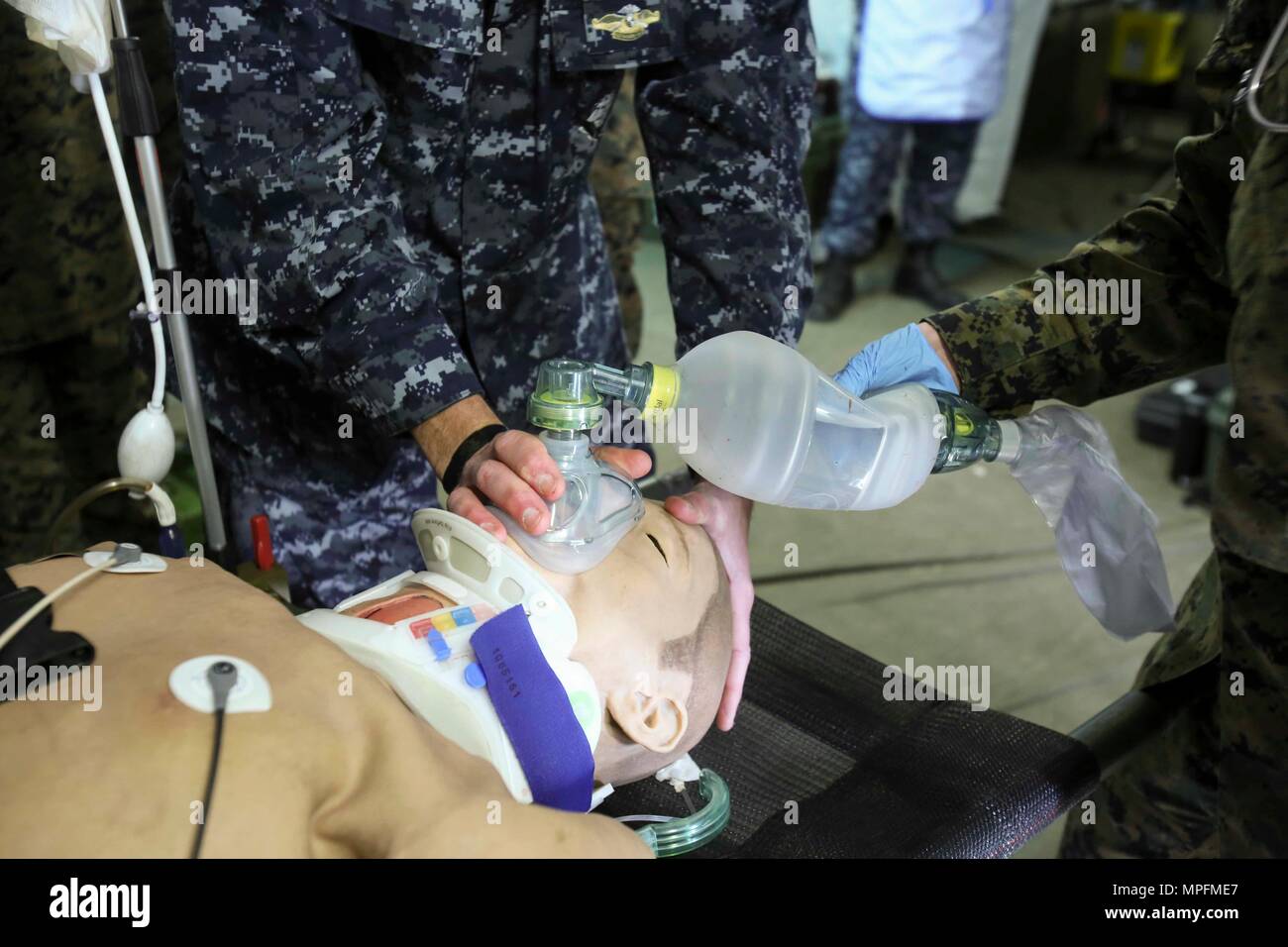 Sailors provide oxygen to a notional patient during Naval Medical Augmentation Program training at Camp Lejeune, N.C., Feb. 27-March 2. The training is designed for Sailors to ensure they maintain their skill sets to save service members’ lives in a deployed setting. The Sailors are with 2nd Medical Battalion. (U.S. Marine Corps photo by Cpl. Ashley Lawson) Stock Photo