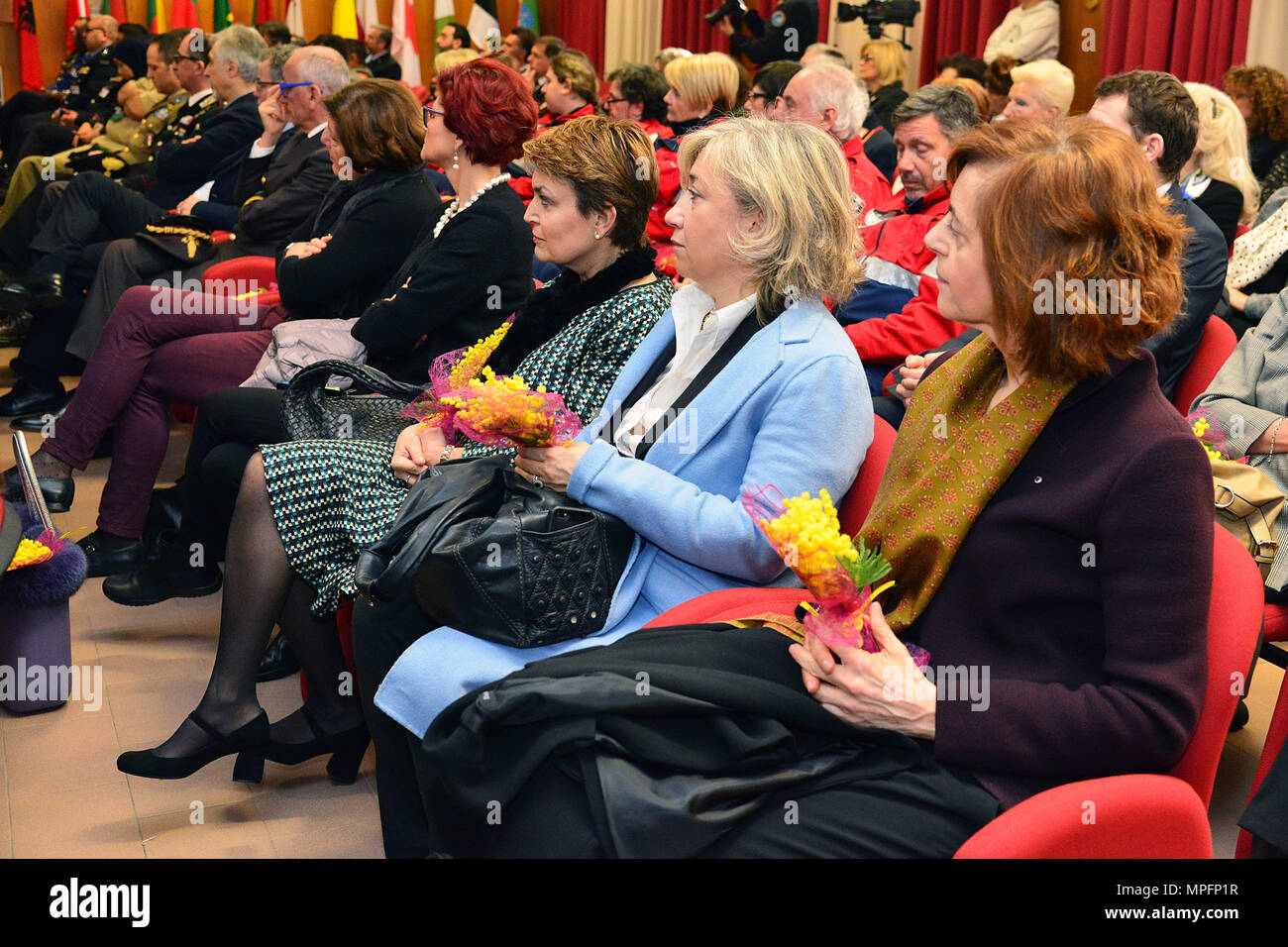 Italian female guests participate in the opening ceremony of the 5th “Gender Protection in Peace Operations” Course at the  Center of Excellence for Stability Police Units (CoESPU) in Vicenza, Italy, Mar. 8, 2017. The event brought together military and civic leaders of the local community and offered the opportunity to celebrate International Women's Day. (U.S. Army Photo by Visual Information Specialist Paolo Bovo/released) Stock Photo