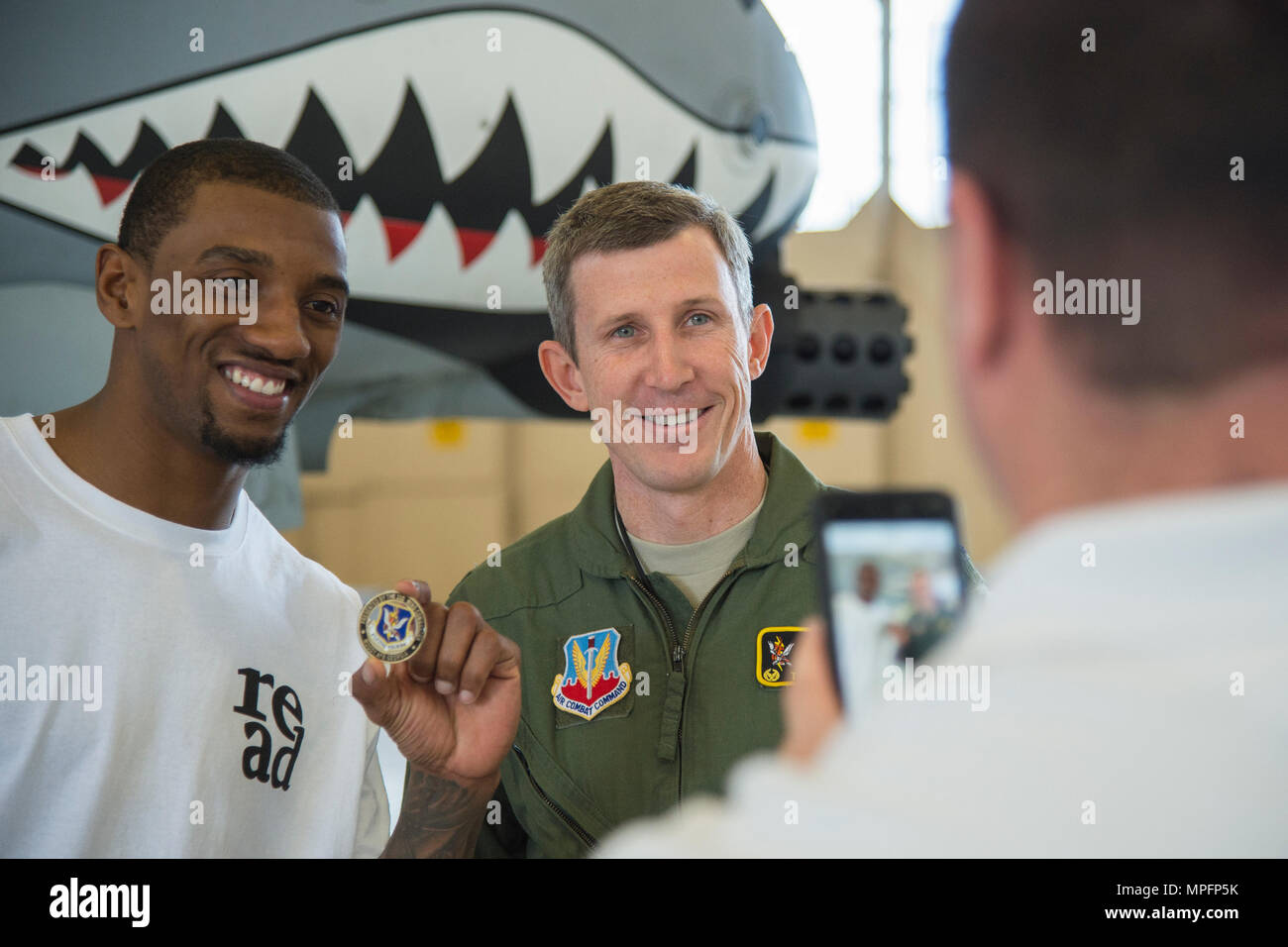 Malcolm Mitchell, left, New England Patriots’ wide receiver and Super Bowl LI Champion and Col. Thomas Kunkel, 23d Wing commander, pose for a photo during his visit March 7, 2017, at Moody Air Force Base, Ga. Mitchell, who is a Valdosta native, got a glimpse of a typical day in the life of some of Moody’s Airmen from the 23d Fighter Group, 23d Maintenance Group, 23d Mission Support Group, and the 820th Base Defense Group. During his visit, Mitchell also spent time with Airmen and signed autographs for local Patriots’ fans. (U.S. Air Force photo by Senior Airman Ceaira Young) Stock Photo