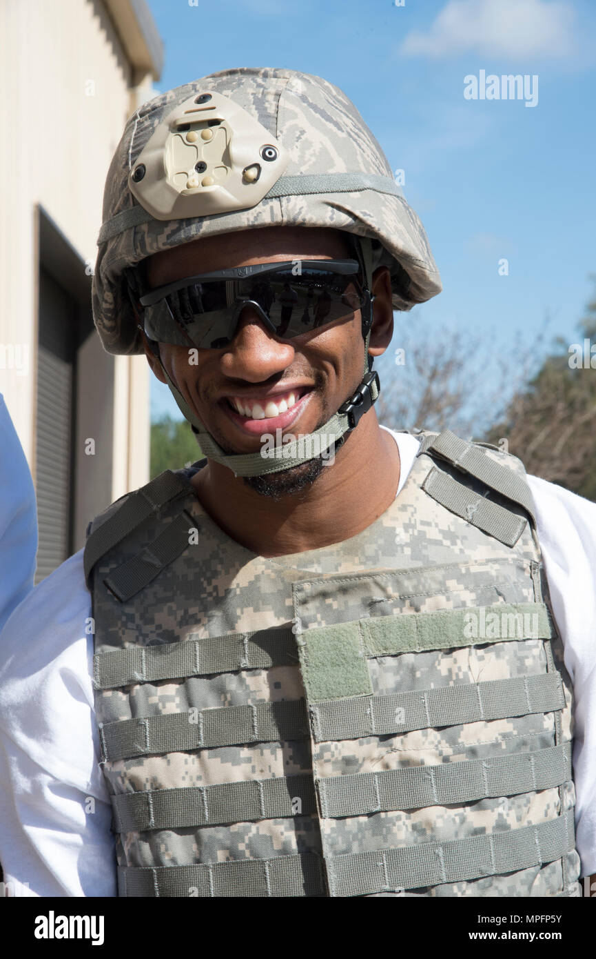 Malcolm Mitchell, New England Patriots’ wide receiver and Super Bowl LI Champion, poses for a photo prior to a rollover demonstration in the Mine-Resistant Ambush-Protected Egress Trainer during a visit March 7, 2017, at Moody Air Force Base, Ga. Mitchell, a Valdosta native, got a glimpse of a typical day in the life of Moody Airmen. Mitchell also spent time with Airmen and signed autographs for local Patriots’ fans during his visit. (U.S. Air Force photo by Andrea Jenkins) Stock Photo