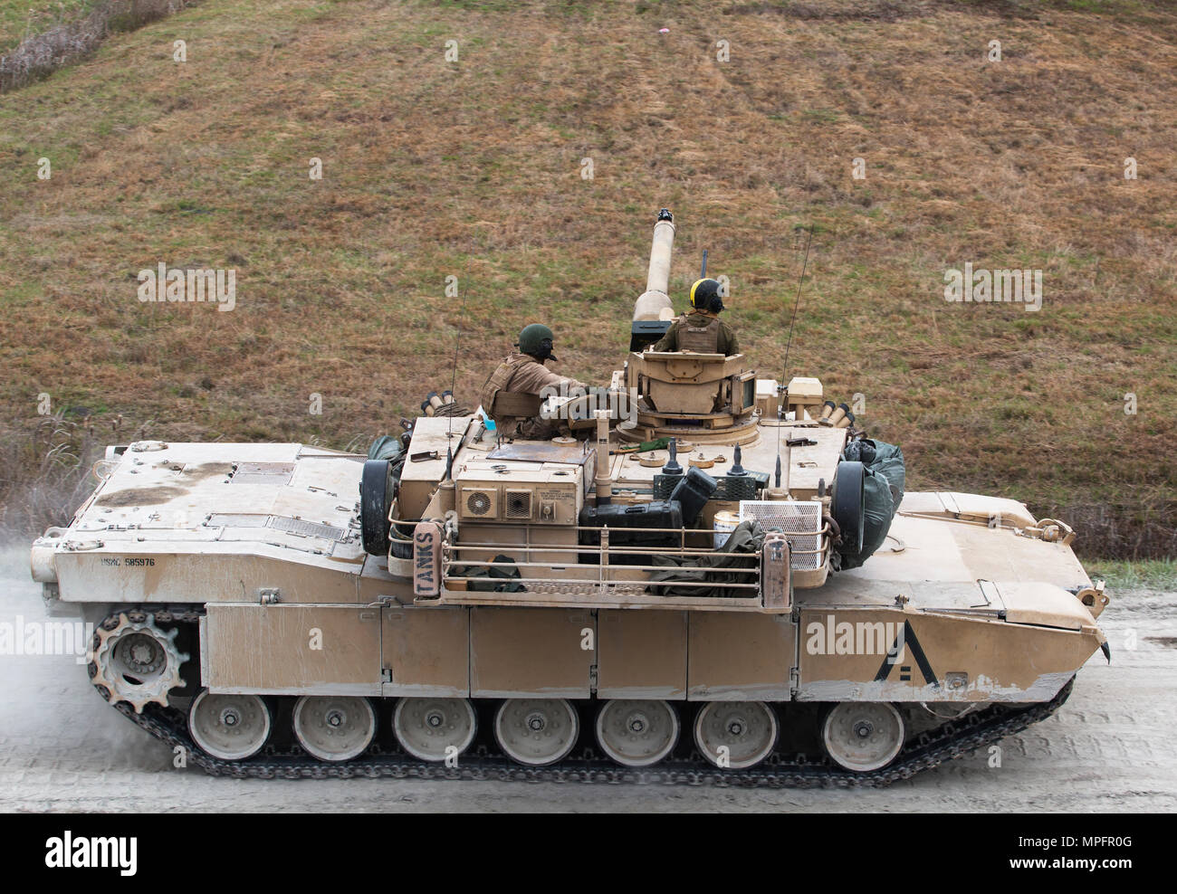 Marines operating an M1A1 Abrams tank aim the main gun down the SR-10 range on Camp Lejeune, N.C., March 8, 2017. 2nd Tank Battalion, 2nd Marine Division conducted a semiannual gunnery qualification for Alpha Company in order to gauge their Marines’ proficiency in combat engagements. (U.S. Marine Corps photo by Lance Cpl. Raul Torres) Stock Photo