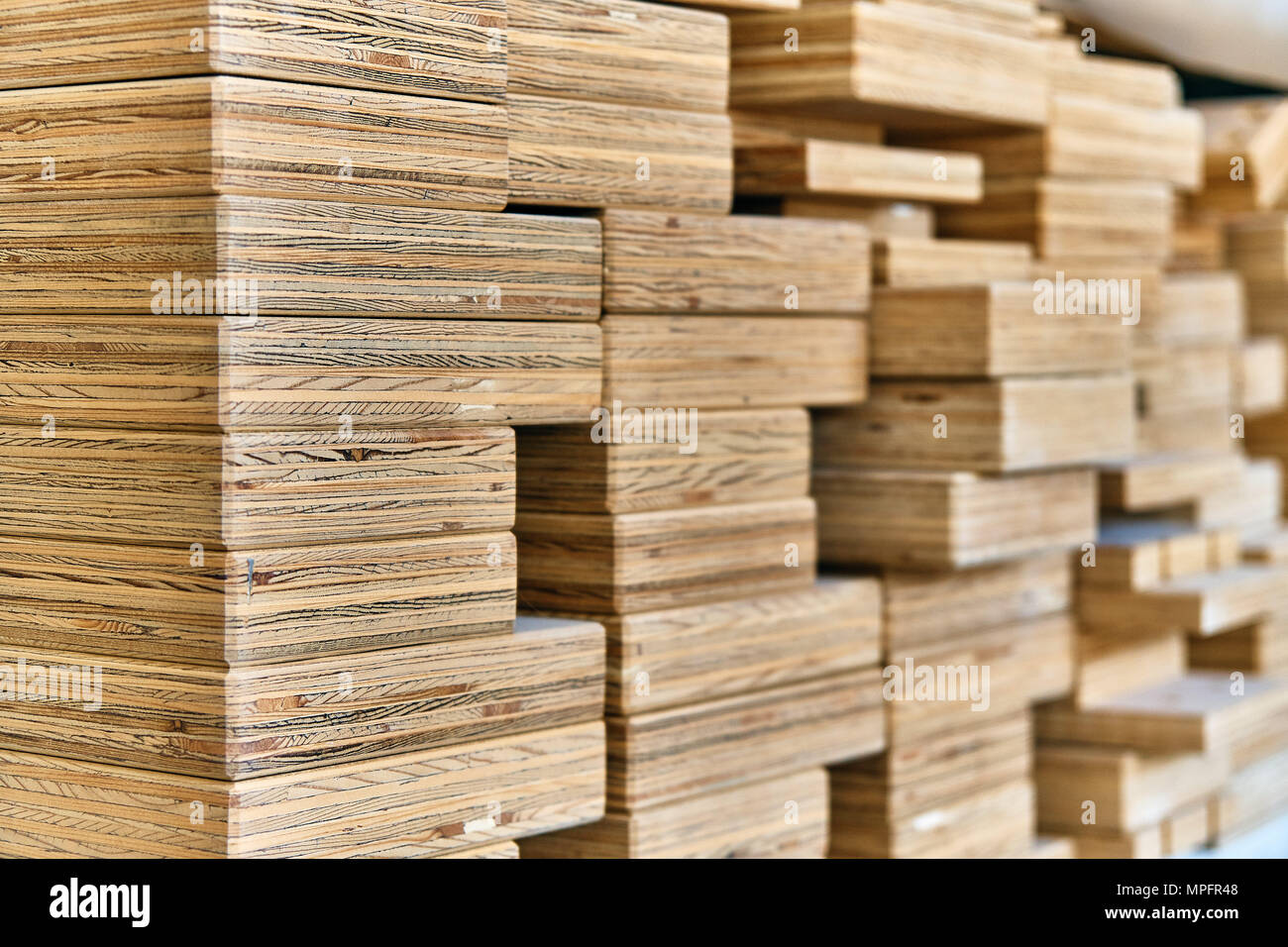 Joinery. Stacked plywood beams in Closeup view Stock Photo