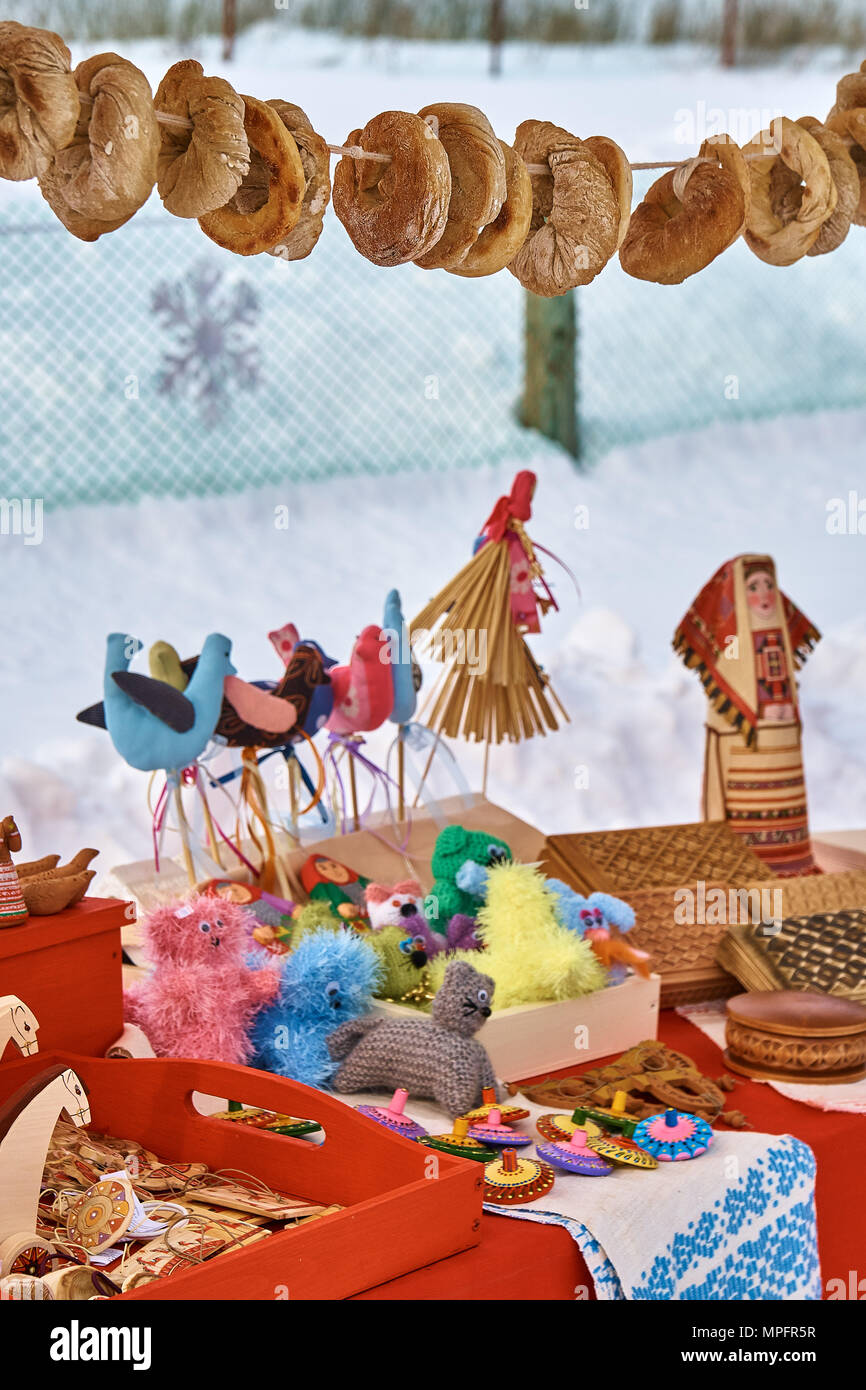 Russian folk dolls, slavic charms. Traditional textile doll. Stall on traditional Russian fair in winter Stock Photo