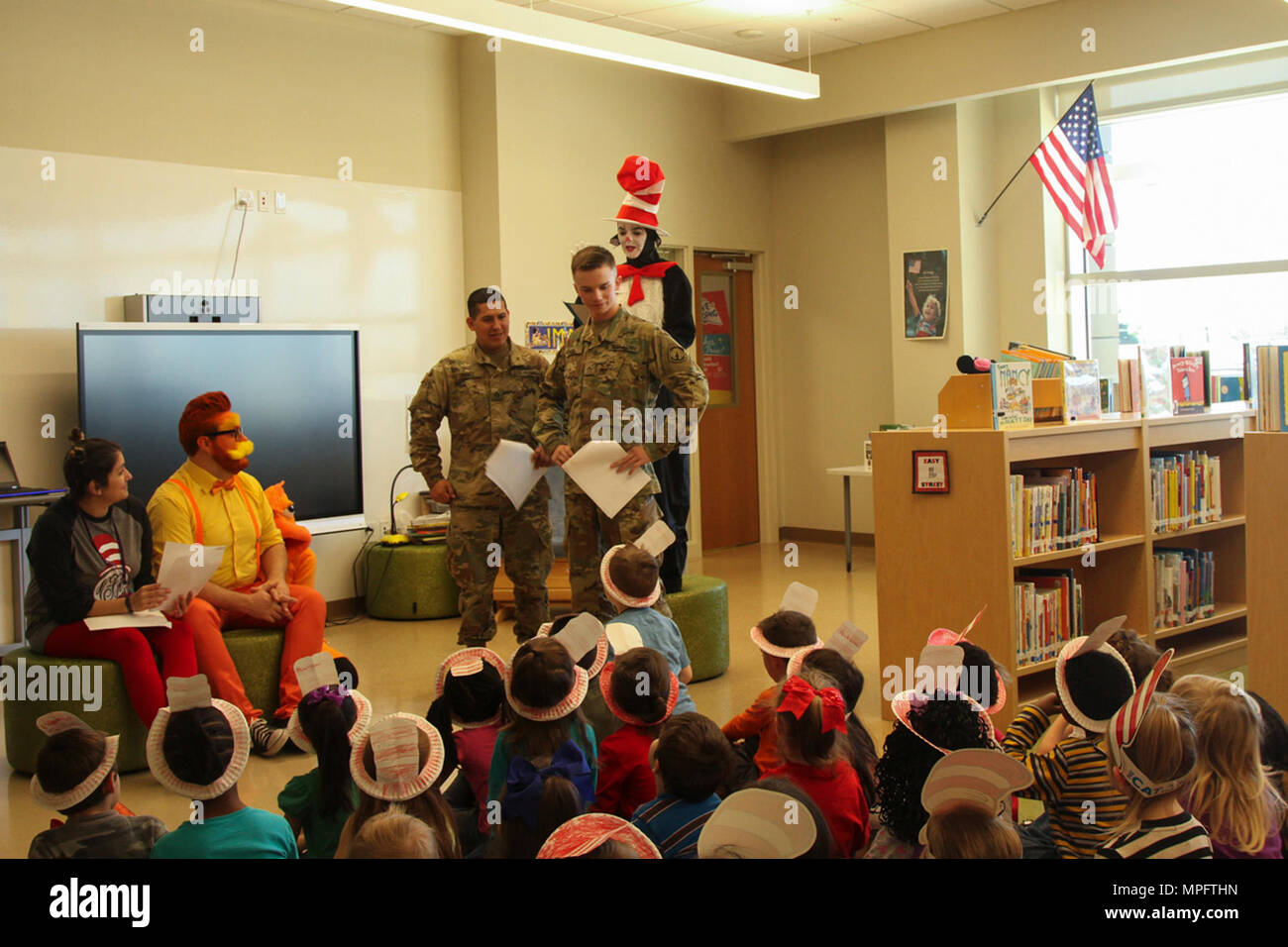 Two Soldiers from the 716th Military Police Battalion, 101st Airborne Division (Air Assault) Sustainment Brigade, 101st Abn. Div., participate in a rehearsal of “The Cat in the Hat” production staff members of Marshall Elementary School put together for the students, March 2, 2017, at Marshall Elementary School on Fort Campbell, Kentucky. The school celebrated the 20th Anniversary of Read Across America by inviting soldiers from 716th MP Bn. To the school and putting the production for the students to encourage and promote reading. (U.S. Army photo by Sgt. Neysa Canfield/101st Airborne Divisio Stock Photo