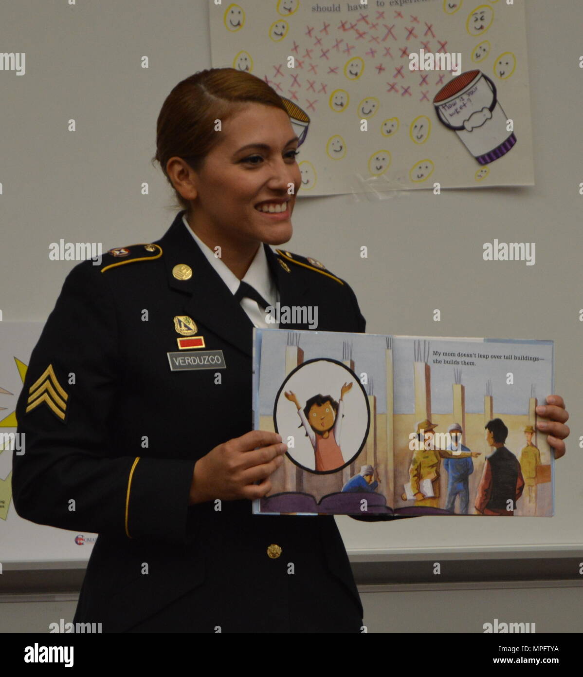 U.S. Army Reserve Sgt. Ana Verduzco with the 4th Sustainment Command (Expeditionary) reads “Hero Mom” to students at Kinder Ranch Elementary in San Antonio, TX, Mar. 10, 2017. (U.S. Army Reserve photo by Maj. Brandon R. Mace) Stock Photo