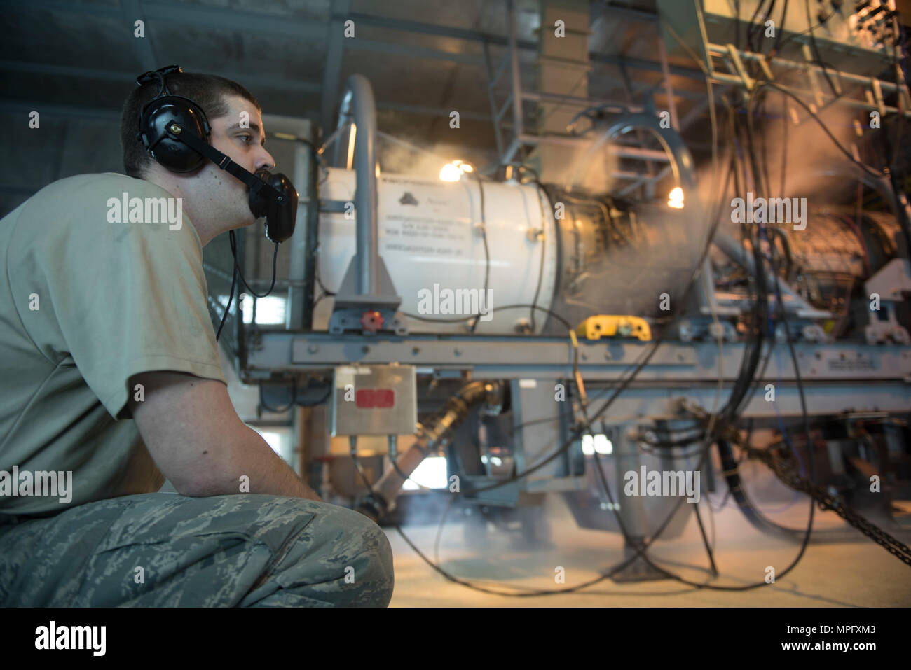 A U.S. Air Force aerospace propulsion craftsman performs a test on an ...