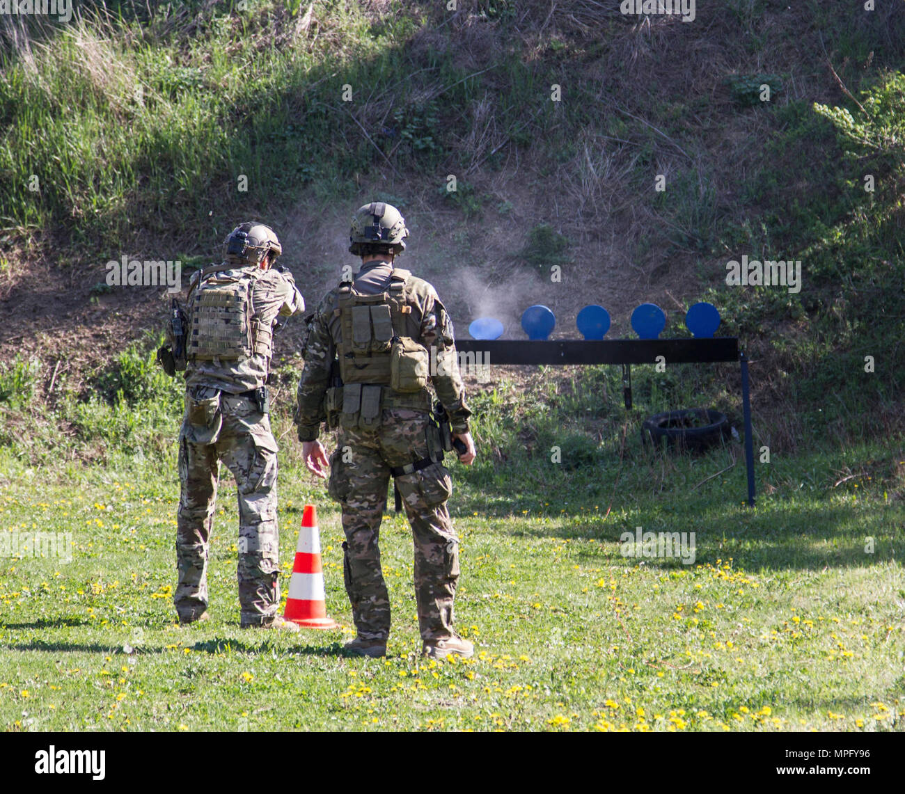 U.S. and Slovenian special operation forces demonstrate the pistol portion of a stress-shoot to the Serbian Special Anti-Terrorist Unit during a Joint Combined Exchange Training at the SAJ headquarters complex, Serbia, April 3-30, 2017. The unit serves as a special operations and tactical unit of the Serbian Police and received training in a variety of tactics and techniques over the course of the JCET to increase their effectiveness in future operations. Stock Photo