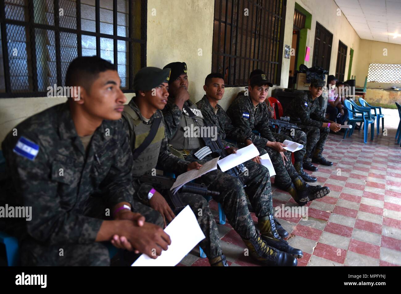 170304-N-YL073-091 TRUJILLO, Honduras (March 4, 2017) - Honduran service members wait for dental services at the Continuing Promise 2017 (CP-17) medical site in Trujillo, Honduras. CP-17 is a U.S. Southern Command-sponsored and U.S. Naval Forces Southern Command/U.S. 4th Fleet-conducted deployment to conduct civil-military operations including humanitarian assistance, training engagements, and medical, dental, and veterinary support in an effort to show U.S. support and commitment to Central and South America. (U.S. Navy photo by Mass Communication Specialist 2nd Class Shamira Purifoy) Stock Photo