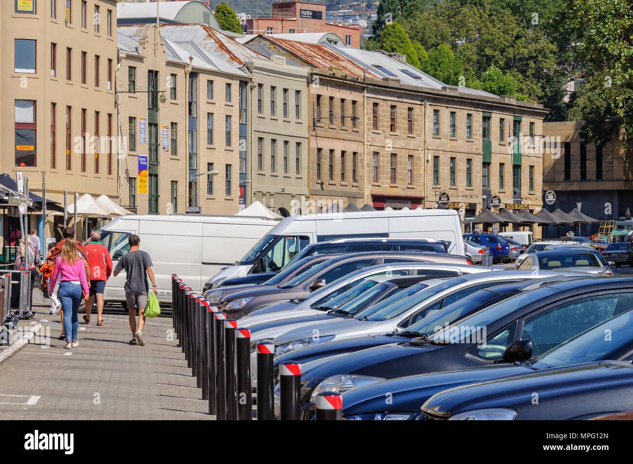 A row of sandstone buildings, formerly warehouses for the port, that have since been converted into restaurants, galleries, craft shops and offices -  Stock Photo