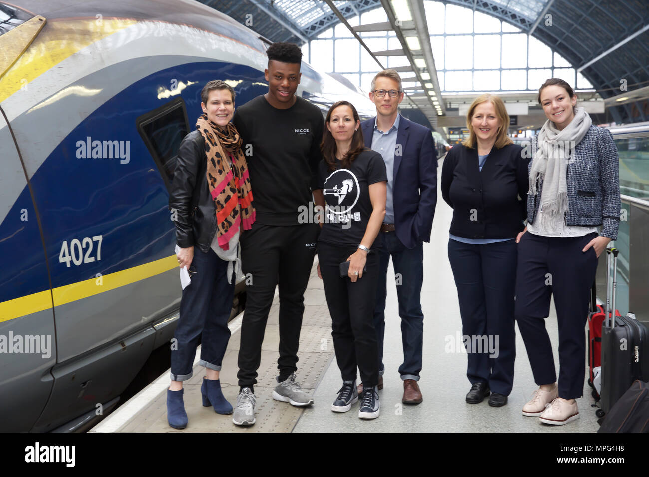 St Pancras, UK. 23rd May 2018. Ky Lewis, Winner of Gigs Eurostar prize poses with the Busking London team before he boards the train to Amsterdam. He set off on a whirlwind busking tour of Amsterdam. He will serenade passengers on the train as they travel under the Channel and complete the day busking in Amsterdam.Credit Keith Larby/Alamy Live News Stock Photo