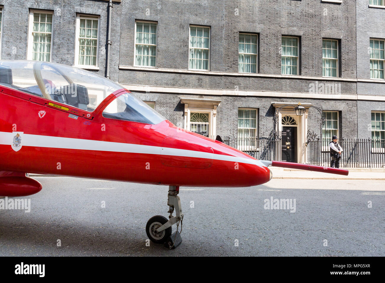 Downing Street, London, UK. 23rd May, 2018. A Red Arrow jet parked outside Number 10 Downing St, London, UK, to mark 100 years of the RAF (Royal Air Force) MUST CREDIT: Chris Aubrey/Alamy Live News Stock Photo